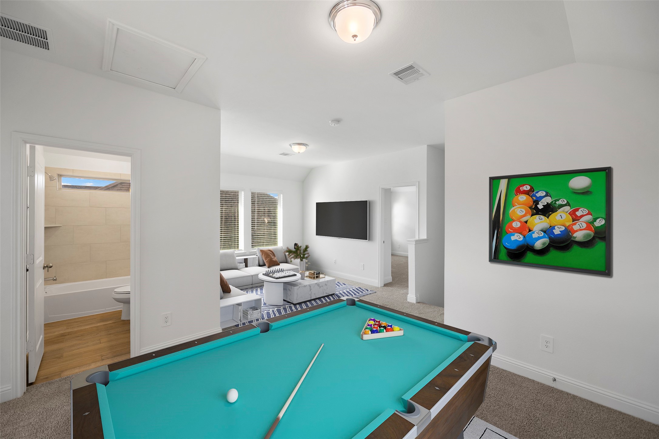 This room is virtually staged to show just one of many options the game room/loft areas can be utilitized.