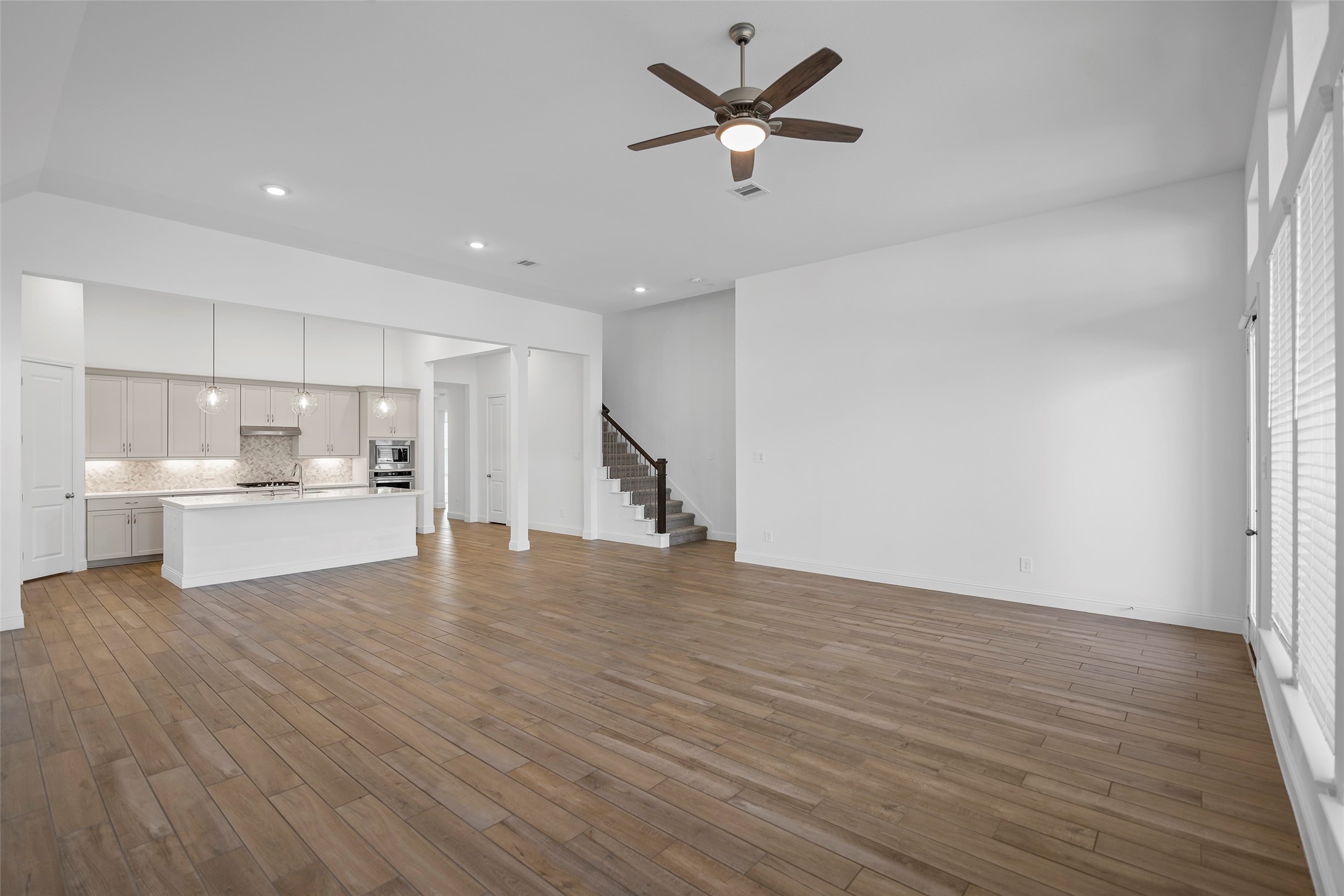 A view of the Family Room, Dining and Kitchen