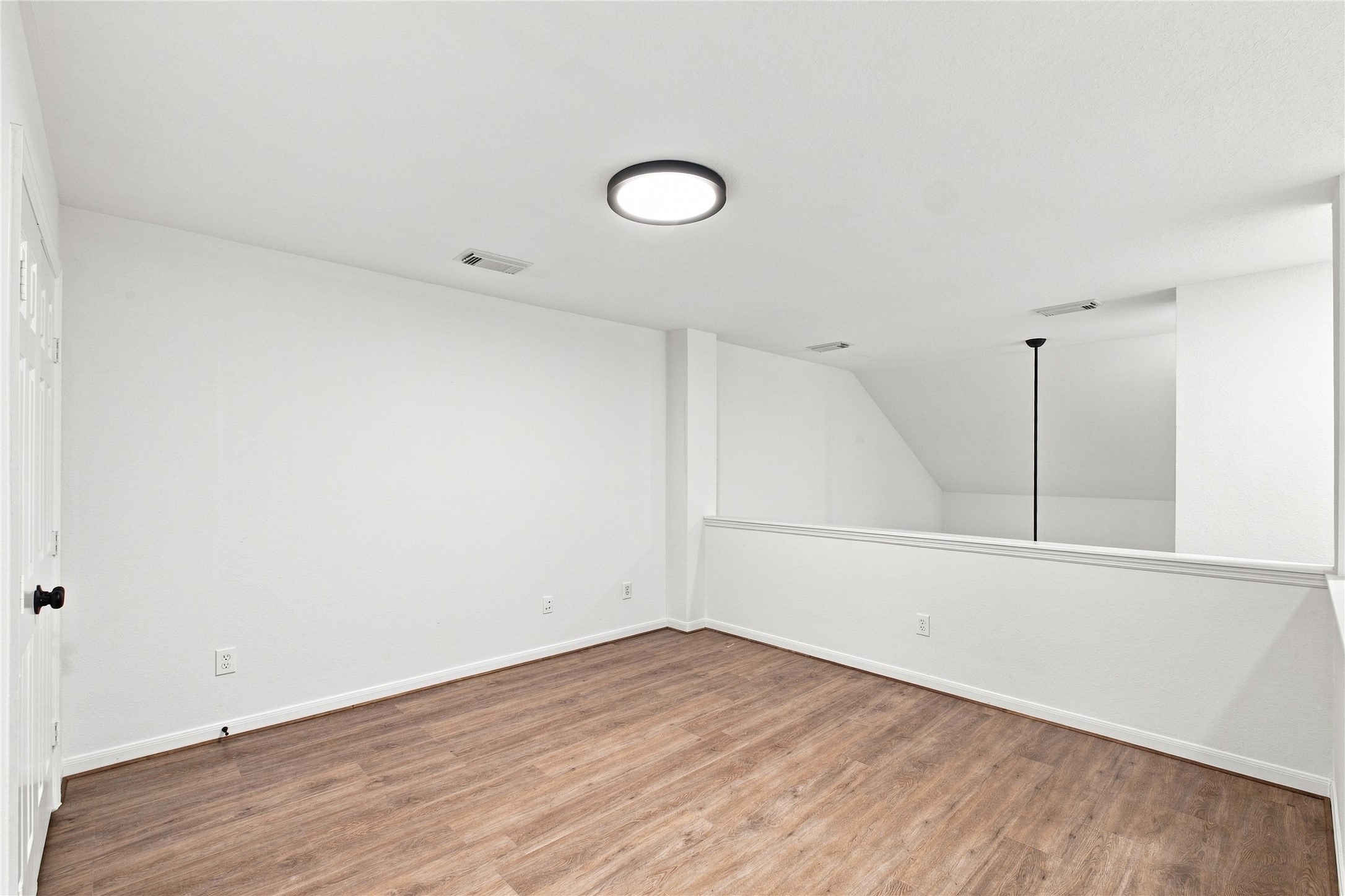 The upstairs loft overlooks the living room and provides flexible space for a home office, reading area or second living space.