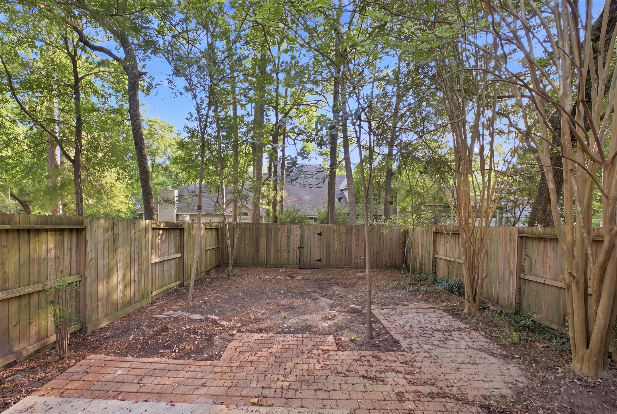 The paver patio provides a ready spot for outdoor seating.