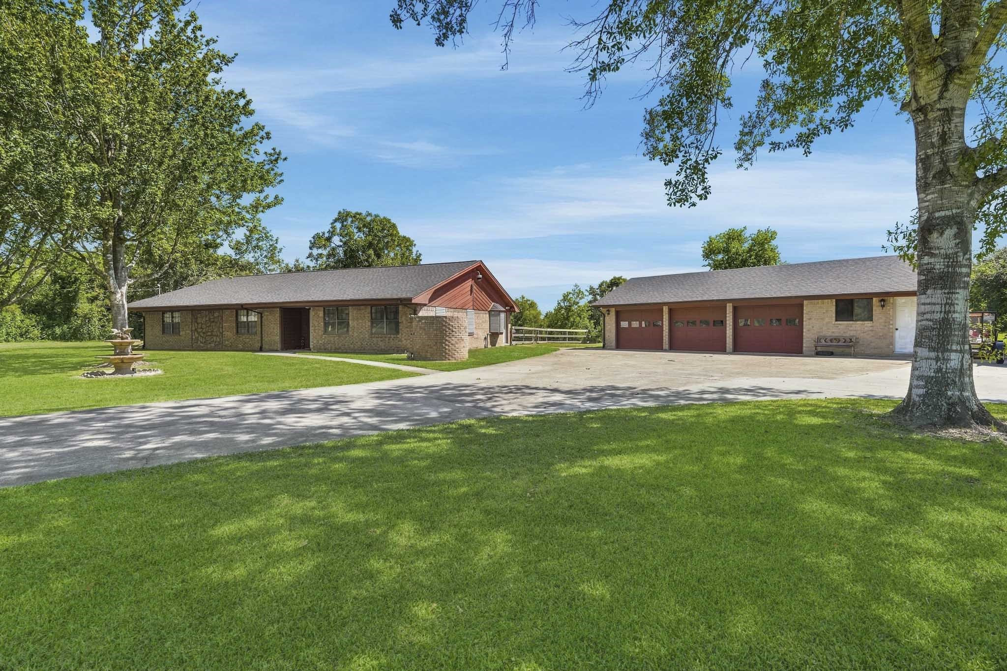 Charming ranch-style home with a spacious front yard, mature trees, and a large three-car garage, perfect for accommodating multiple vehicles or extra storage. Charming ranch-style home with a spacious front yard, mature trees, and a large three-car garage, perfect for accommodating multiple vehicles or extra storage.