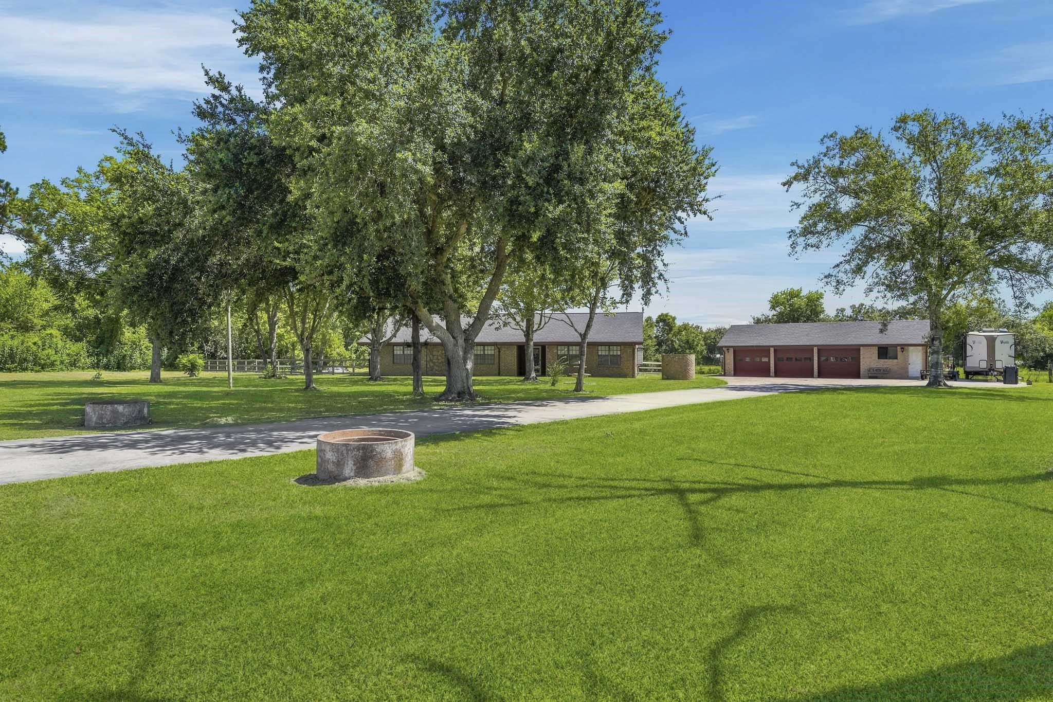 Welcome to 16101 Bluebird St! 1+ acres with an oversized 3 car garage greets you home! Expansive green lawn leads to a charming home shaded by mature trees, perfect for serene living.