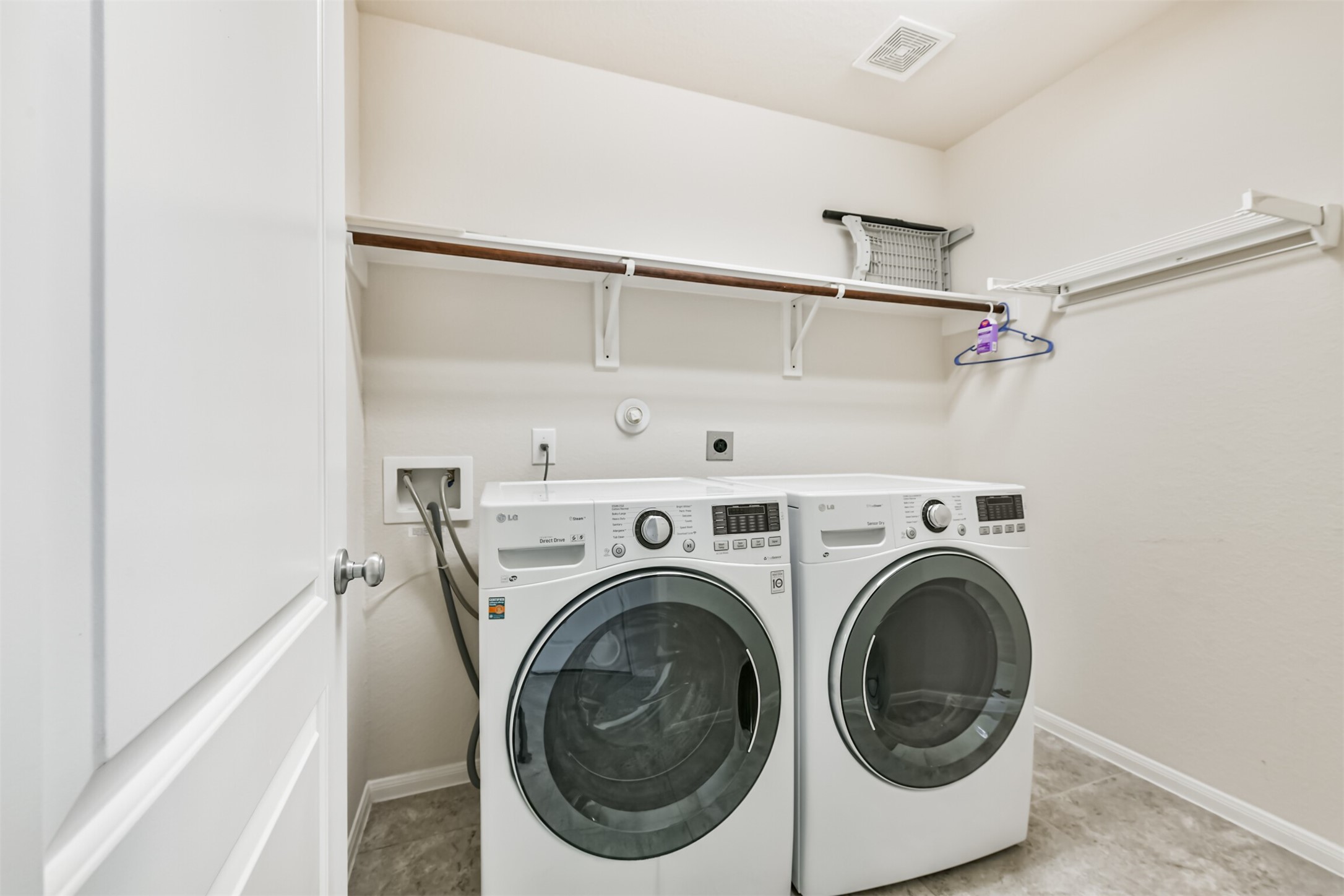 Convenient first-floor laundry room for easy access and efficiency.