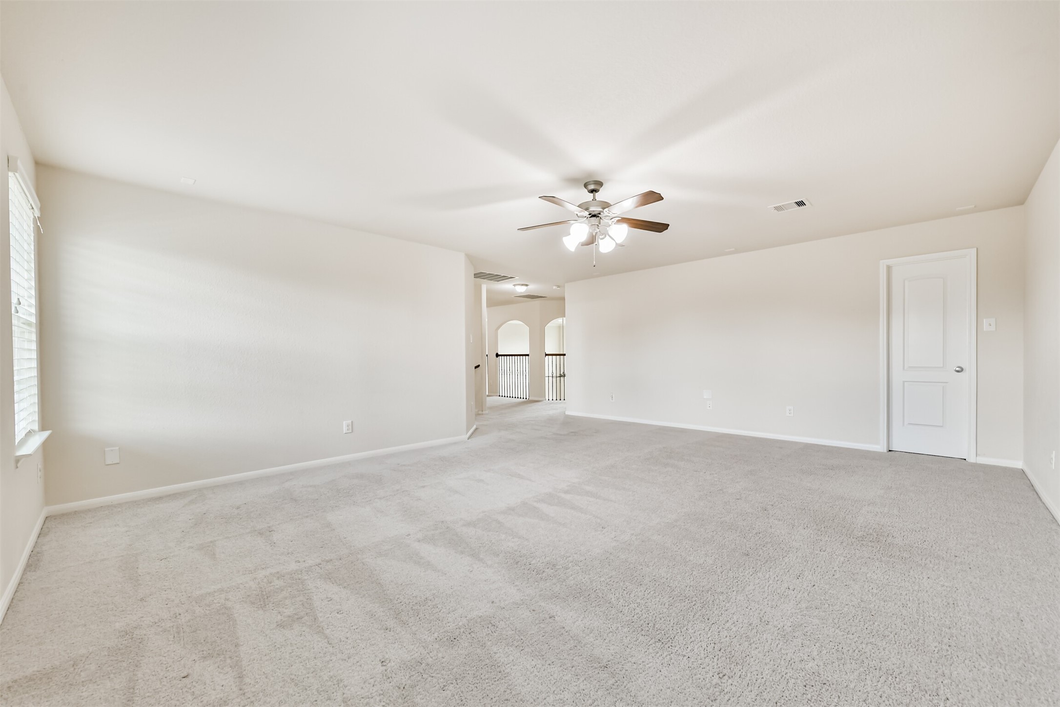 Expansive upstairs game room, perfect for entertainment and relaxation.