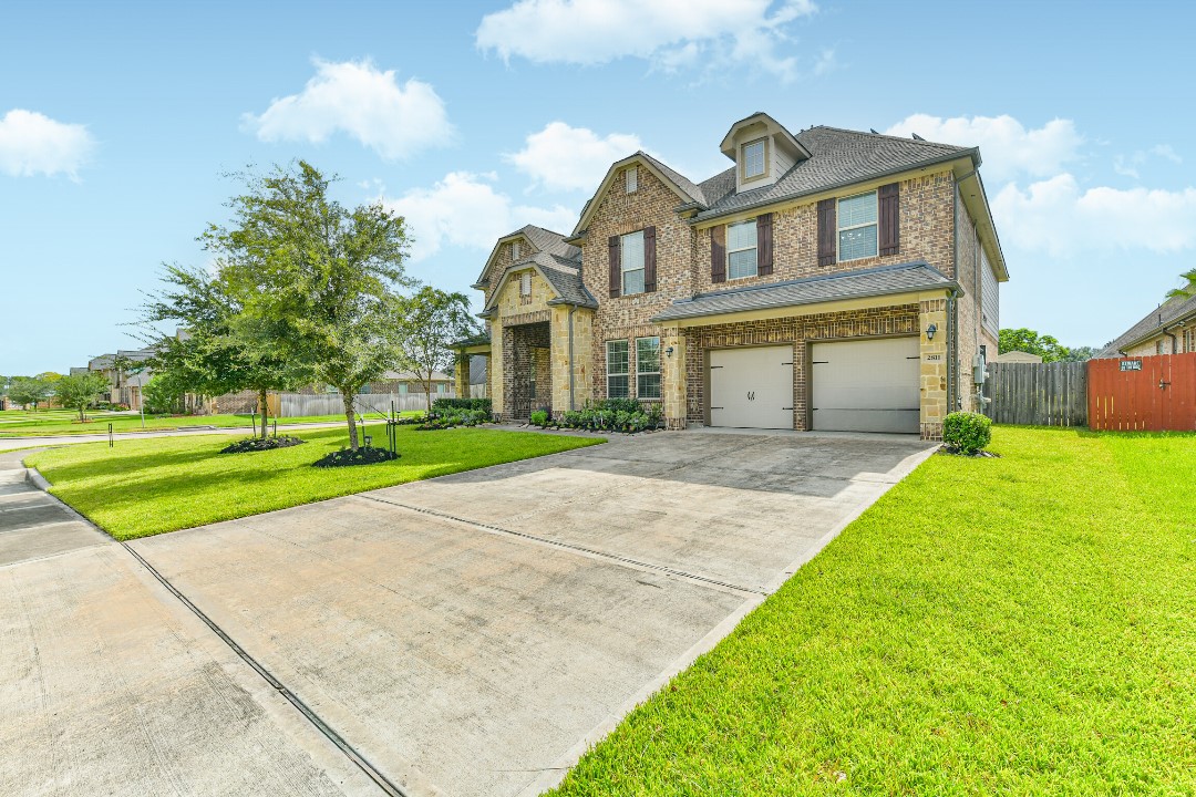 Discover your dream home! This stunning brick house offers timeless elegance, a spacious driveway, and a beautifully manicured lawn. Perfect for comfortable living and entertaining.