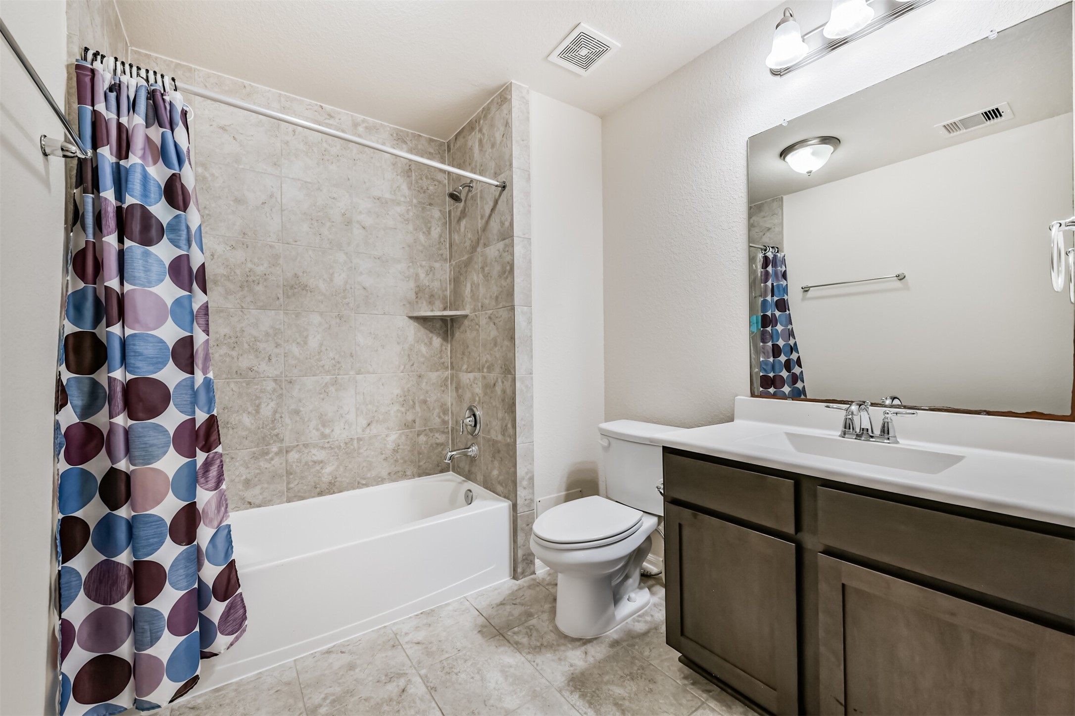 Spacious full bathroom on the upper level.