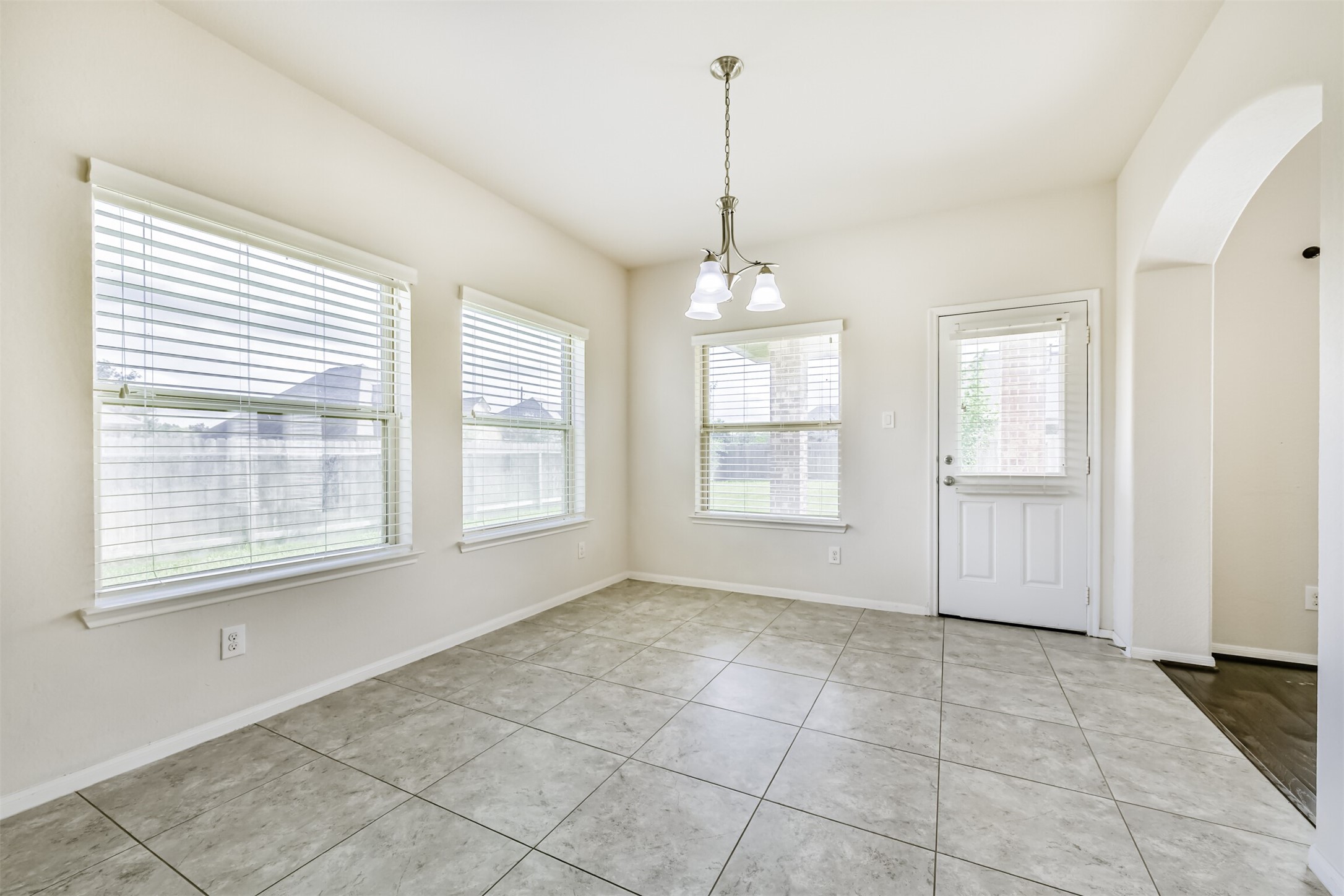 Bright and welcoming breakfast nook with ample natural light, perfect for enjoying your morning coffee.