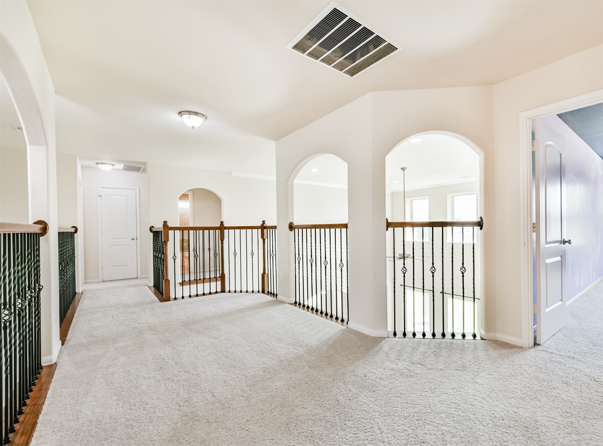 Bright and spacious upstairs landing, perfect for a cozy reading nook or additional seating area.