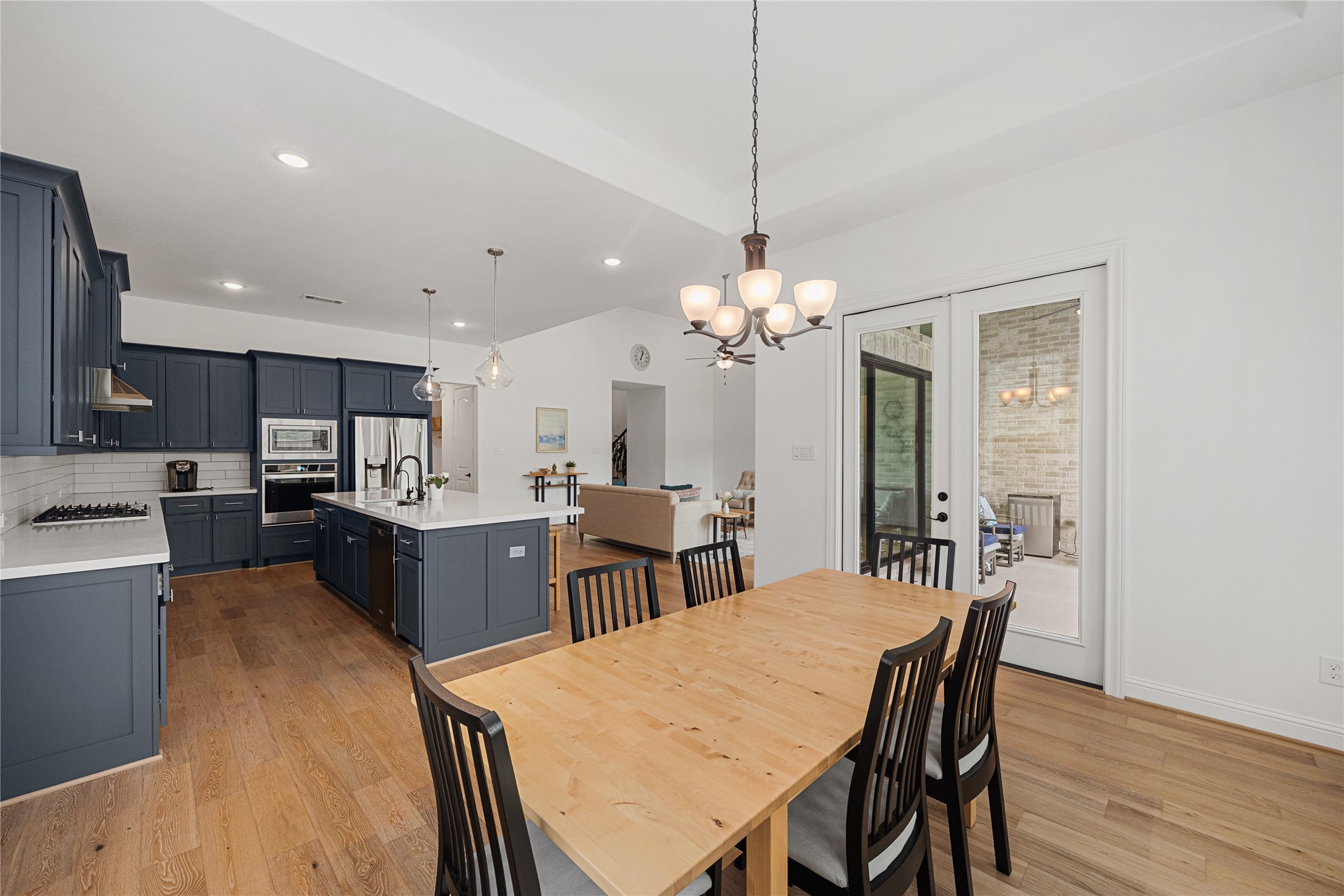 Another view of the dining room and kitchen.