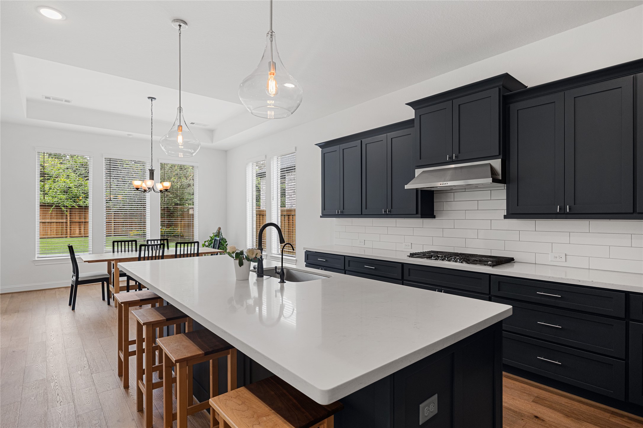 Chef's Kitchen with shaker-style cabinets hardware and an oversized island.