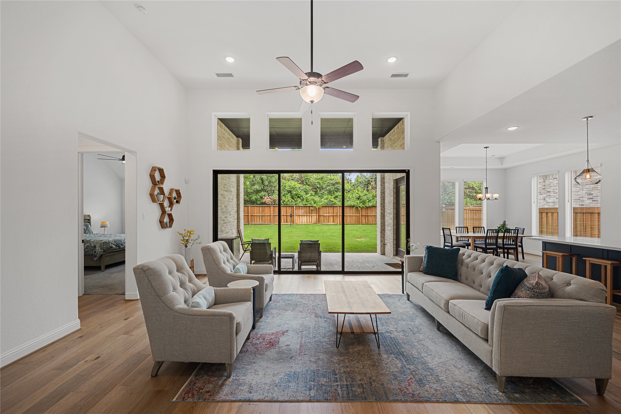 Living room area with stackable sliding doors.