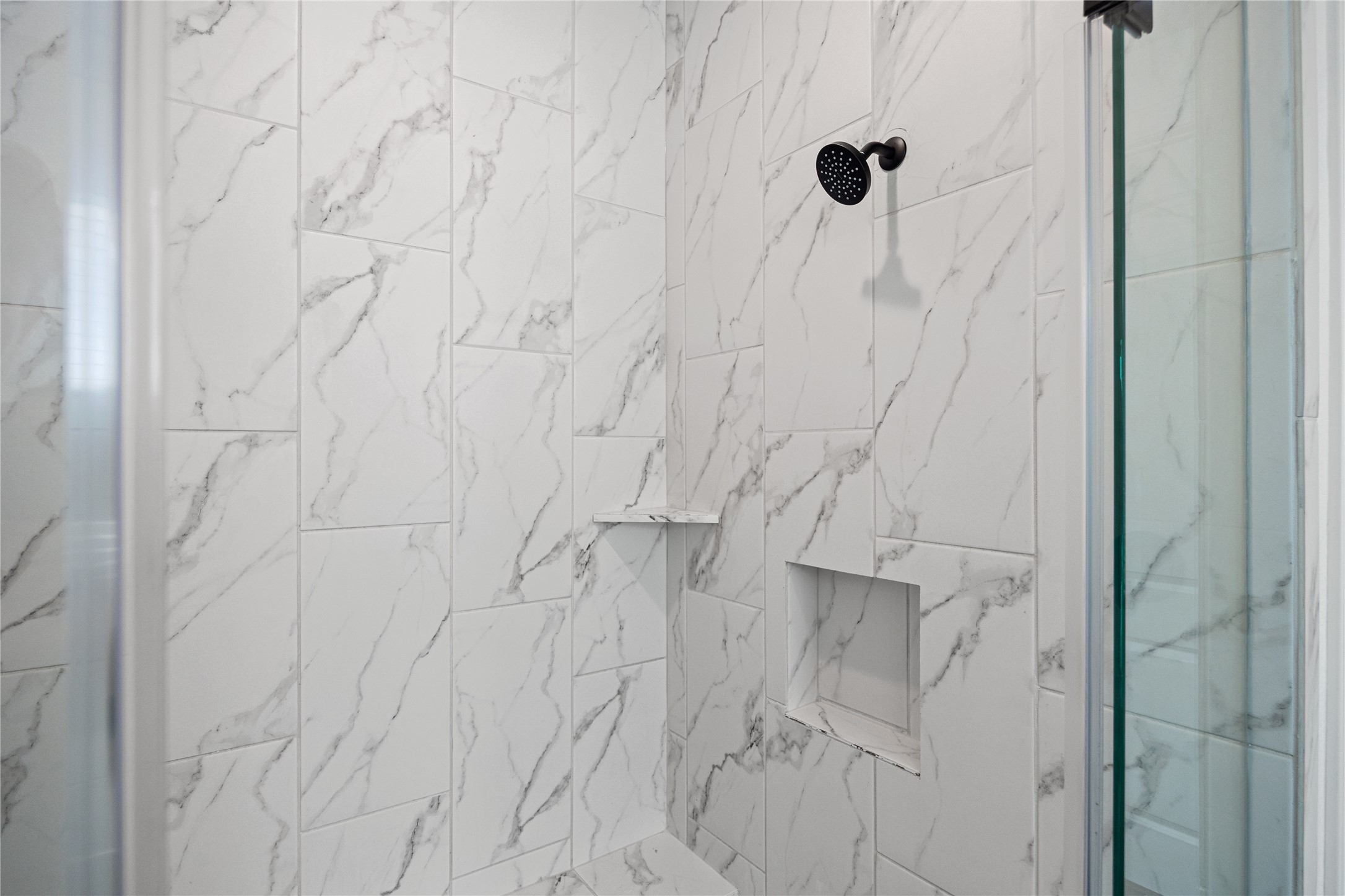 Walk-in shower in the primary bathroom.