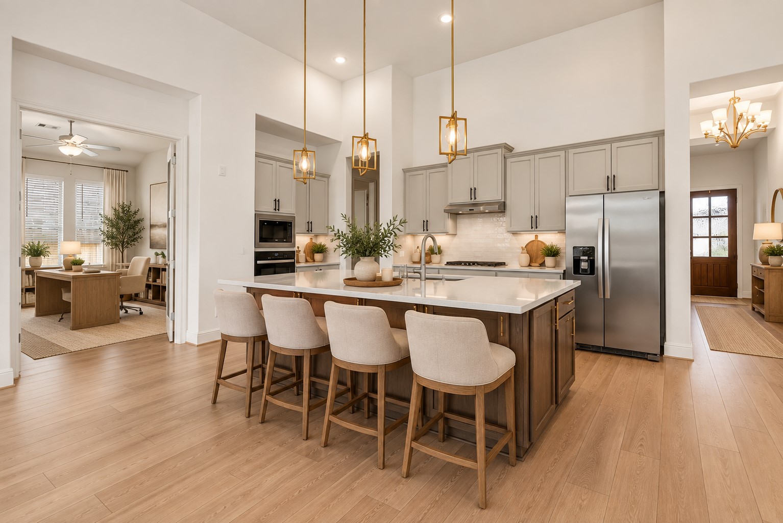 The beautifully appointed kitchen opens seamlessly to the living room and features an oversized island, stainless steel appliances, and 42-inch cabinetry with crown molding.