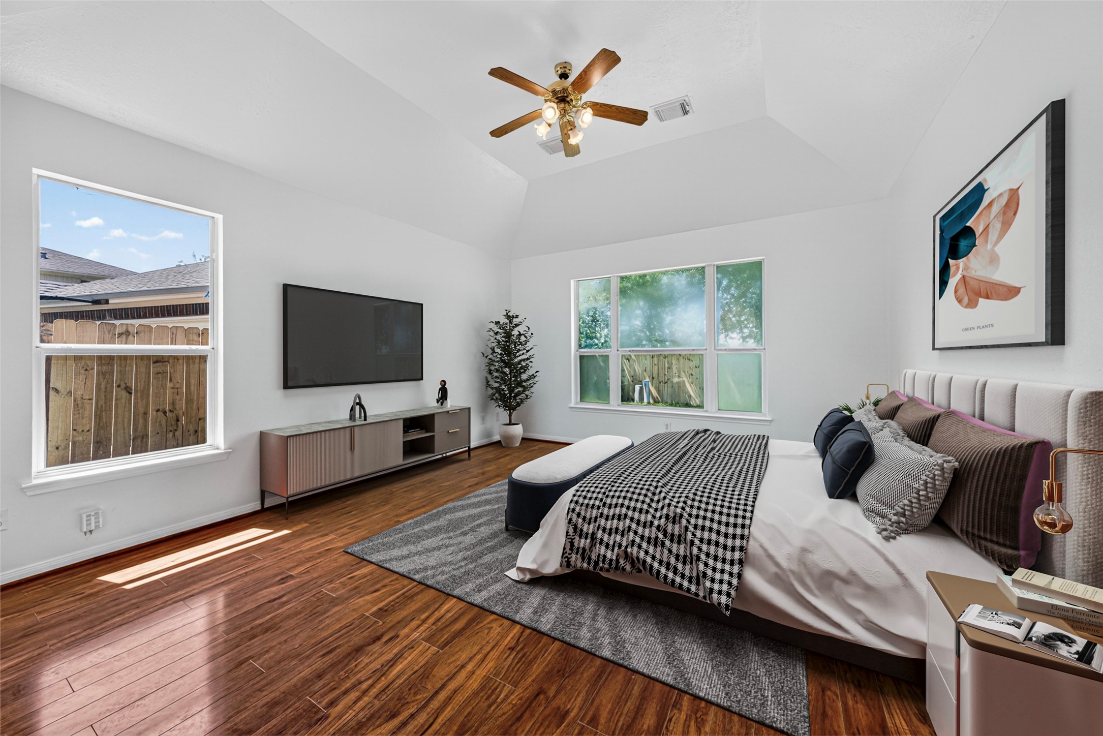 The master bedroom is exceptionally spacious and serves as a true retreat with multiple windows creating a bright atmosphere.