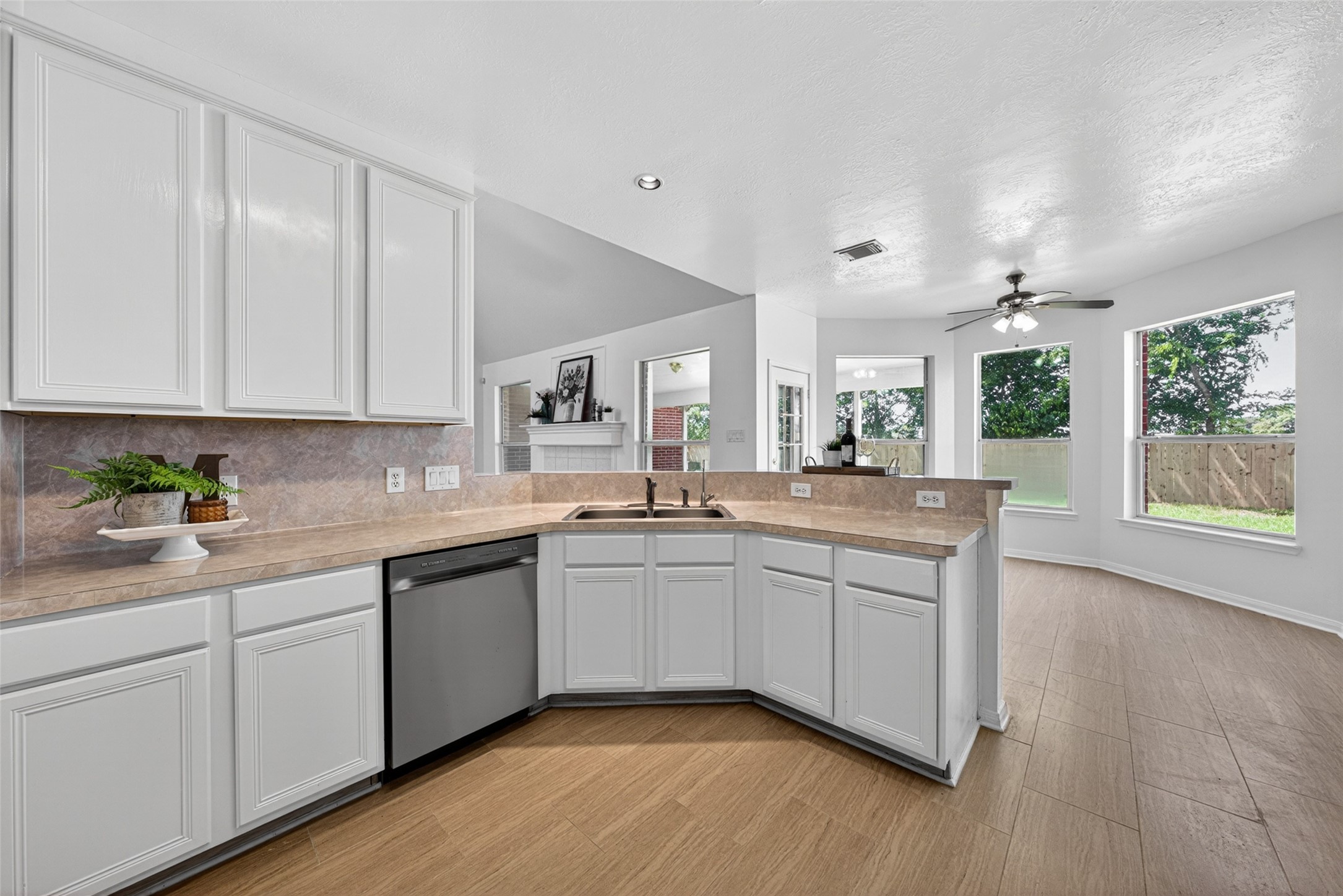 Overlooking the breakfast area and living area, this open-concept kitchen ensures you never miss a moment while preparing meals or entertaining guests.