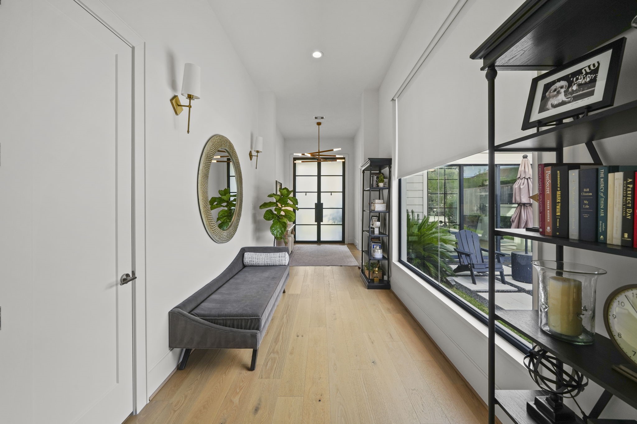 The entry is stunning with a wall of windows over looking the pool and outdoor space!