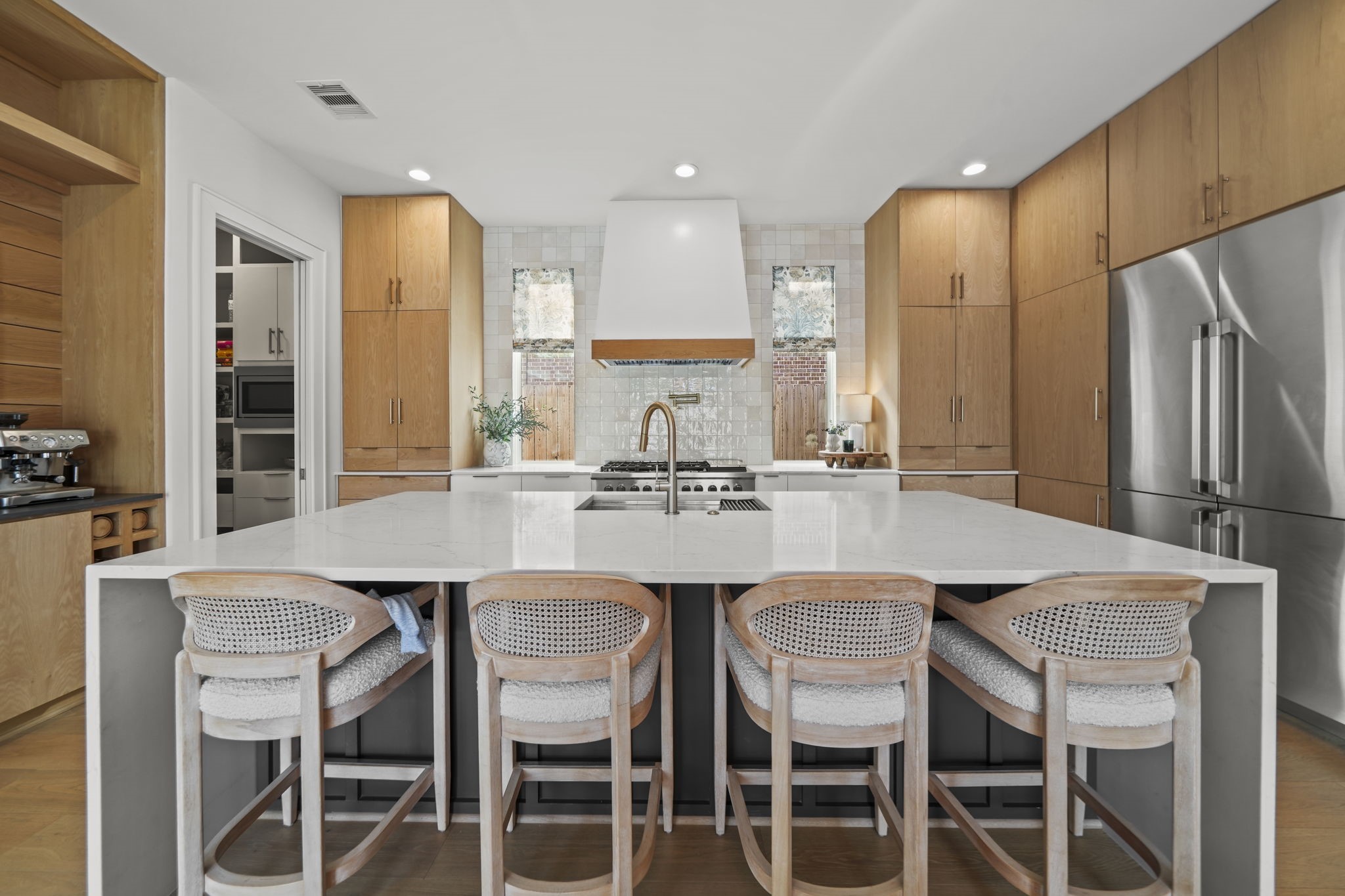 The kitchen is stunning! Quartz countertops, built in refrigerator/freezer, pot filler and more!