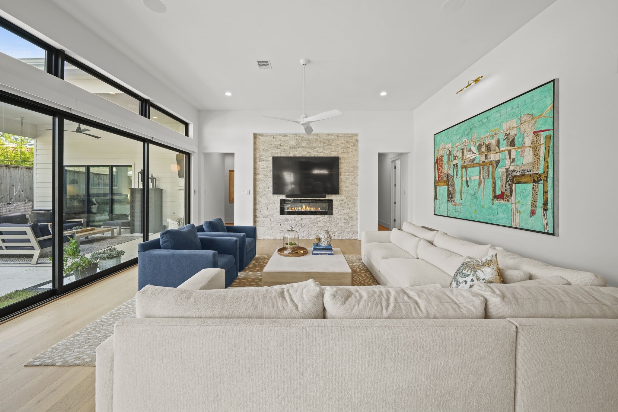 One of two living spaces in the home and opens up for indoor/outdoor entertaining!