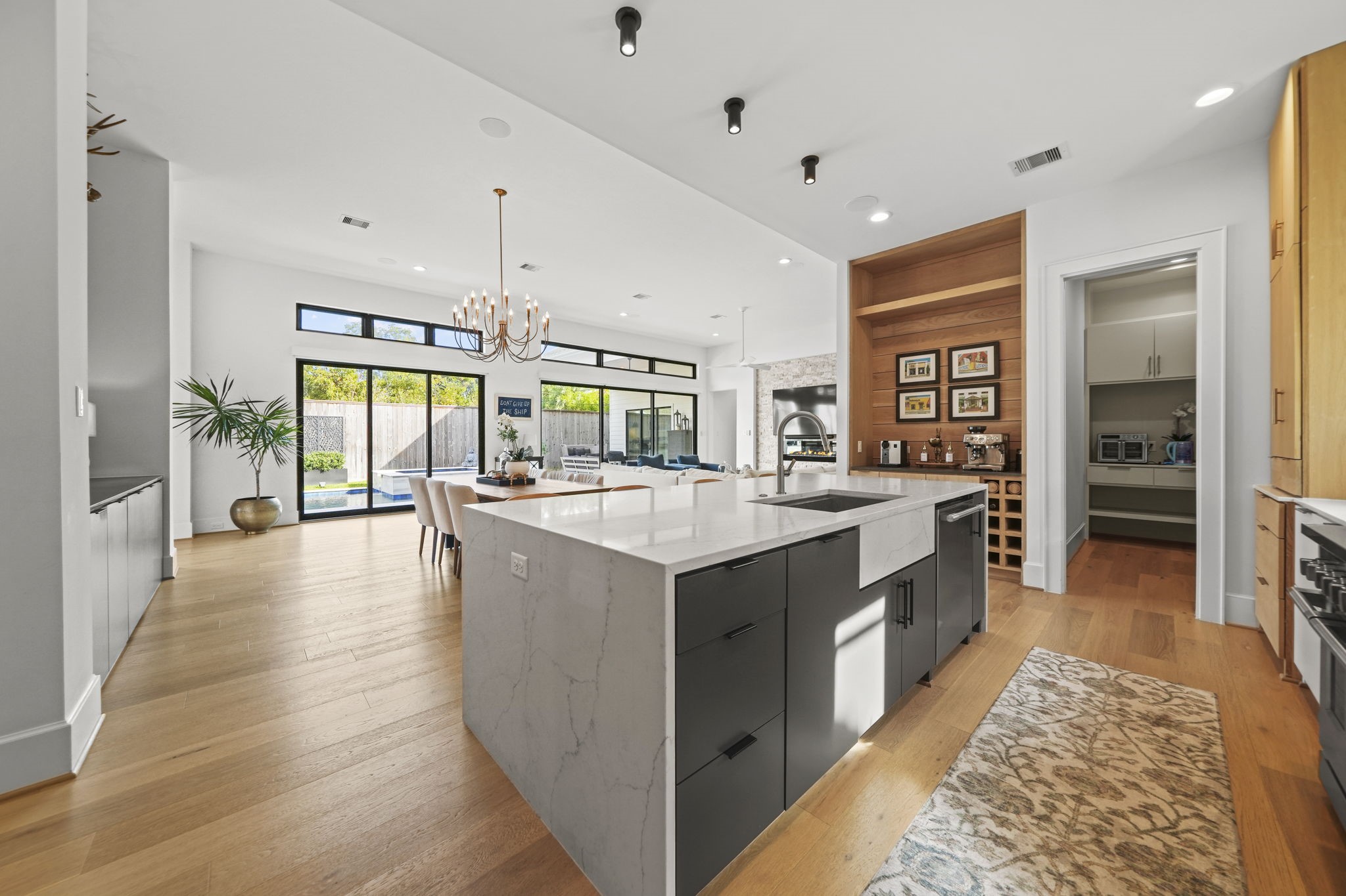 The kitchen is open to the dining area and large living space with sliding doors out to the pool!