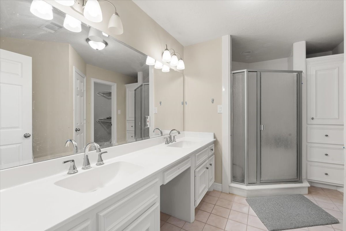 Primary bath with double sinks and walk in shower