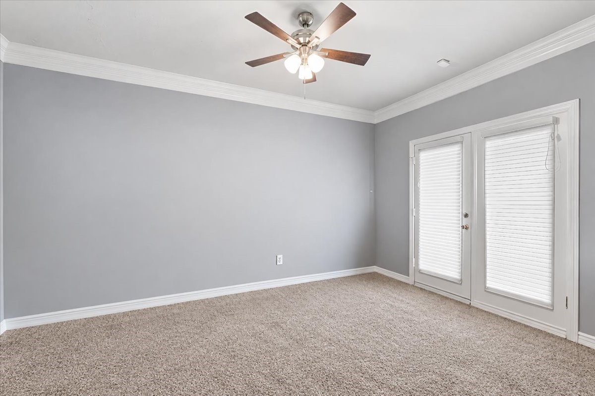 Primary bedroom has french doors leading to the covered patio to enjoy your morning coffee