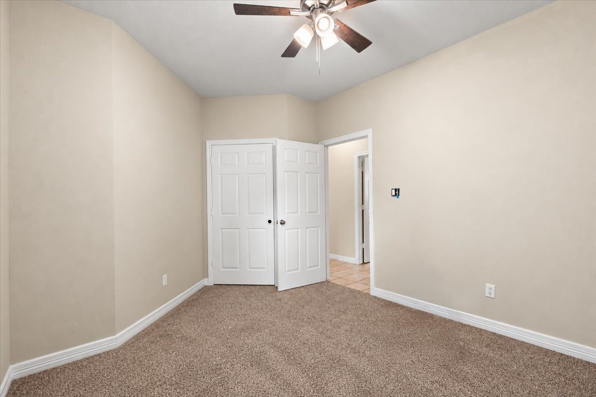 Upstairs bedroom with custom built ins in closet