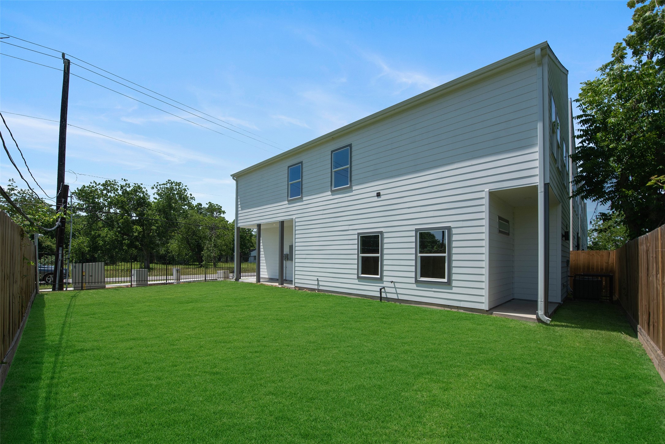 Another view of the large, gated side yard offering privacy and versatile outdoor space for play, pets, and entertaining. Call to request a showing!
