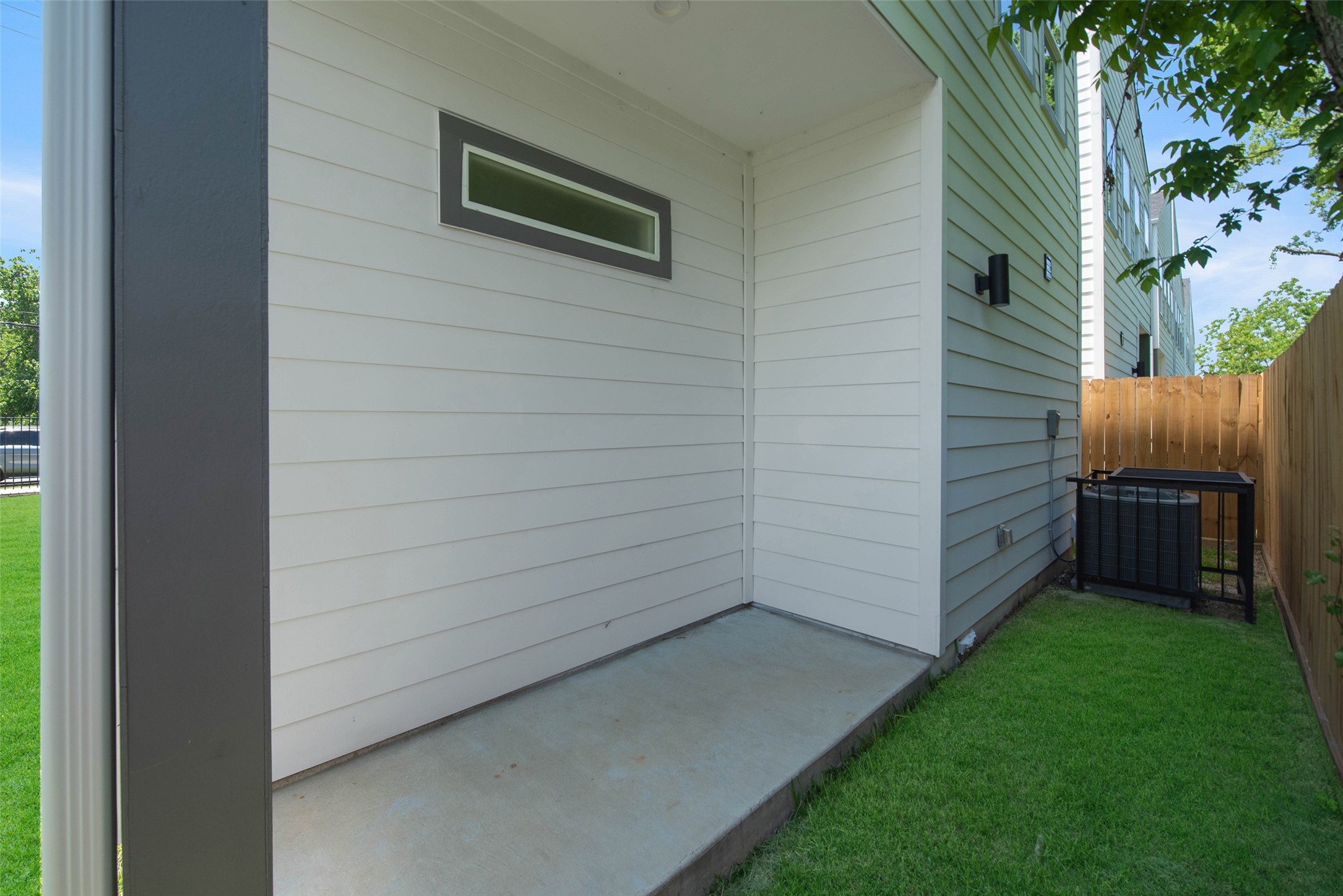 The covered patio provides a comfortable outdoor retreat, perfect for relaxing year-round.