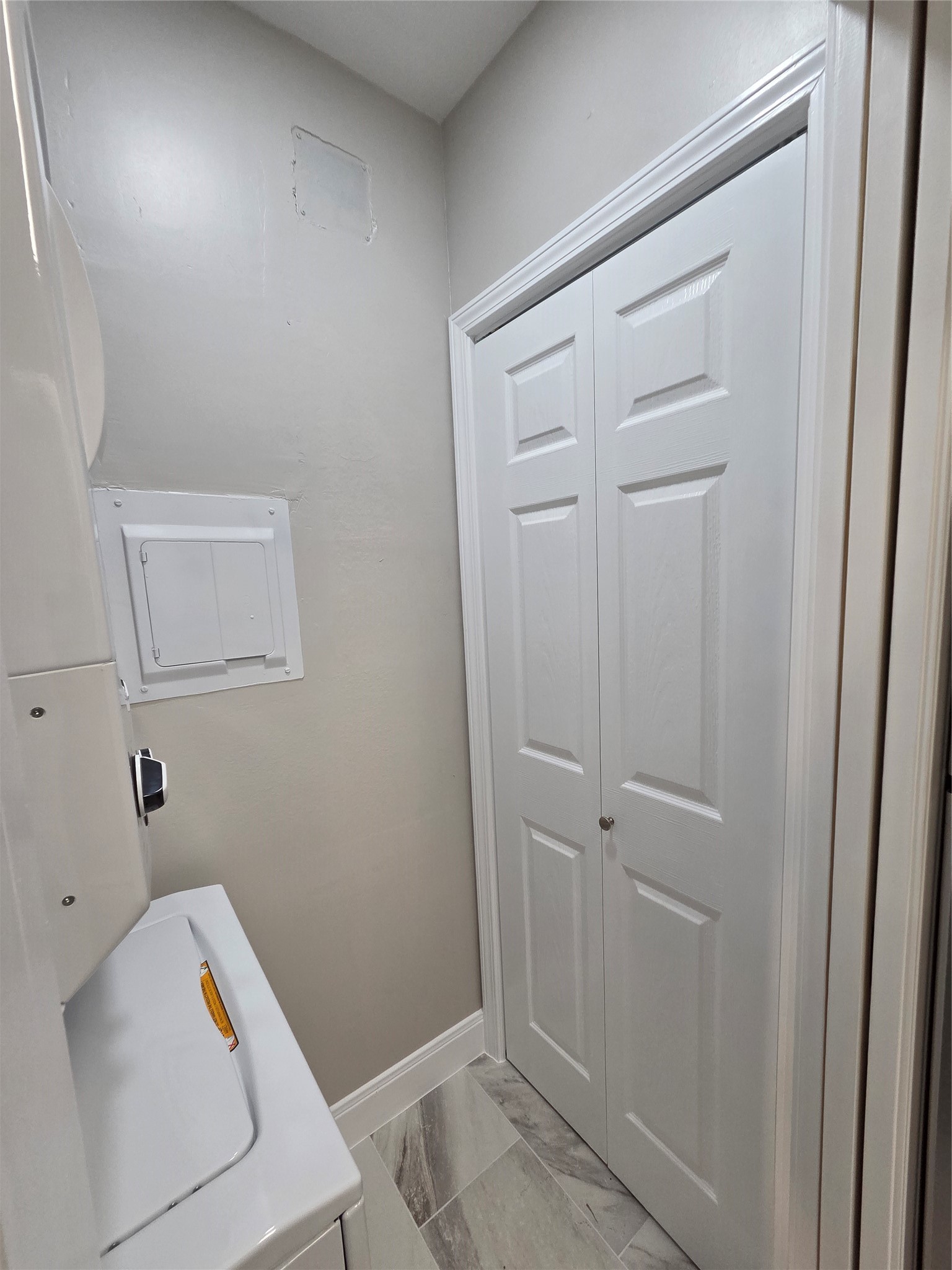 Closed in pantry and laundry room behind the pocket door in kitchen