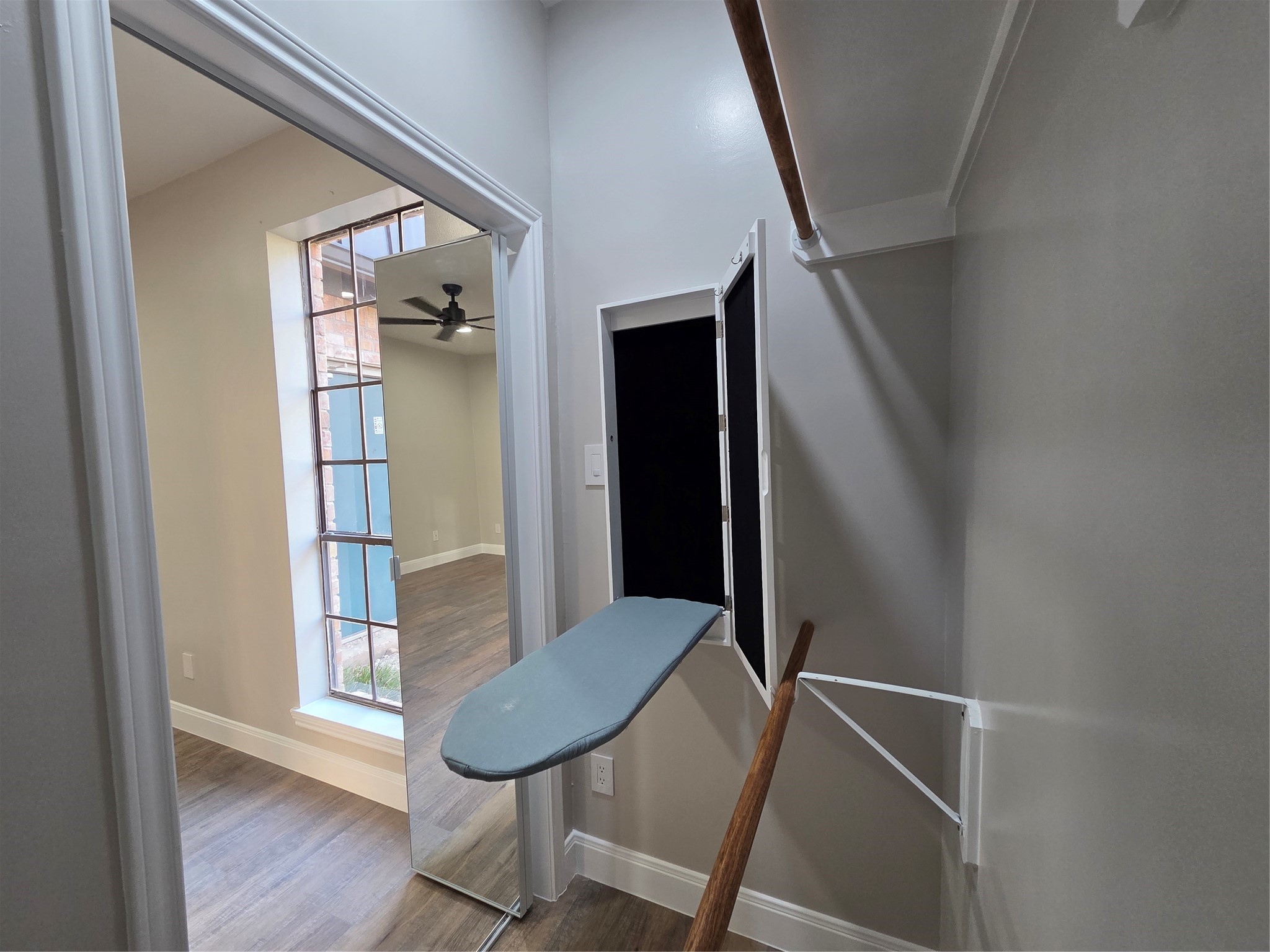 2nd closet offers an attached ironing board