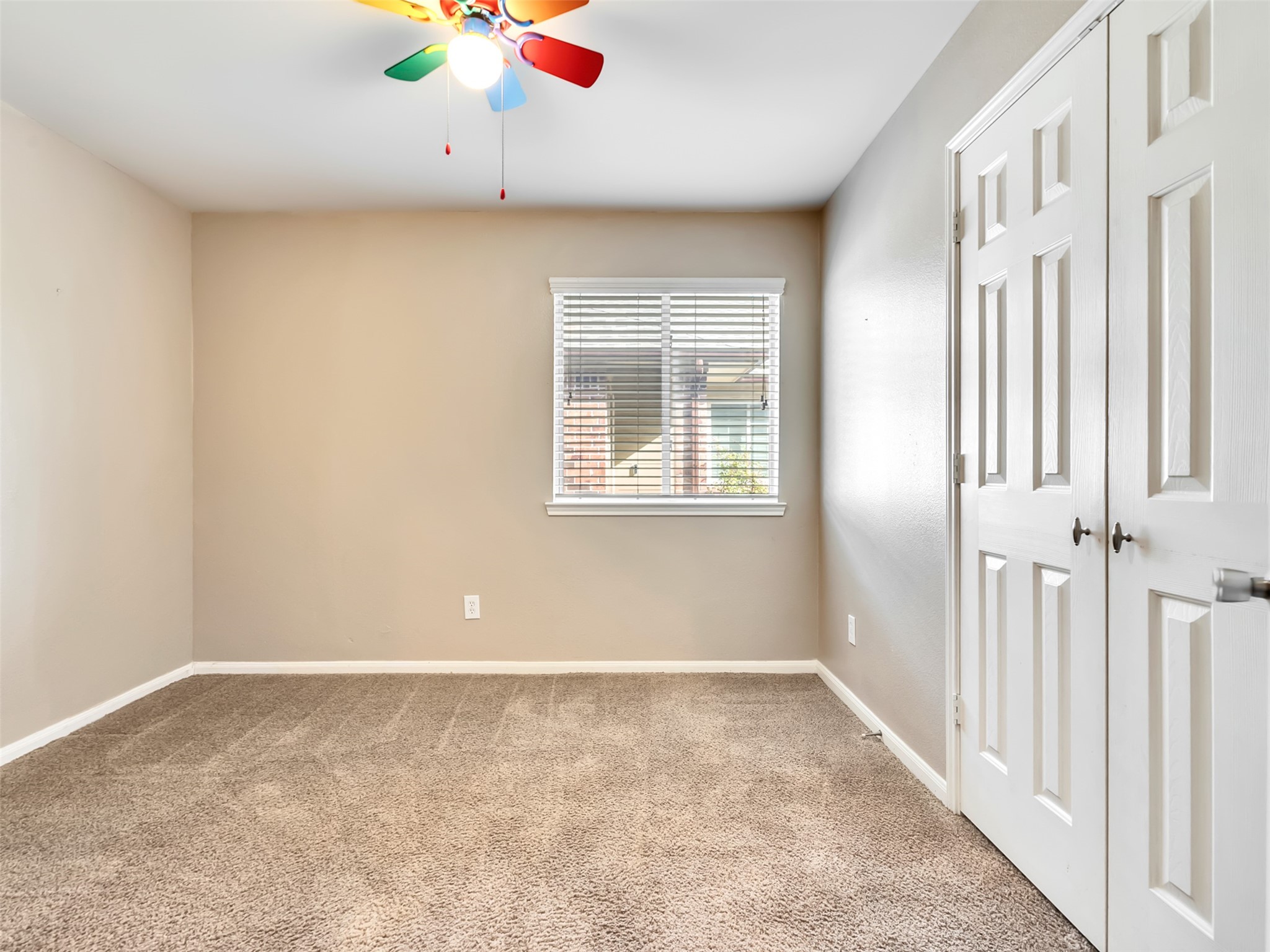This comfortable guest bedroom is perfect for overnight visitors, a home office, or a cozy hobby room.