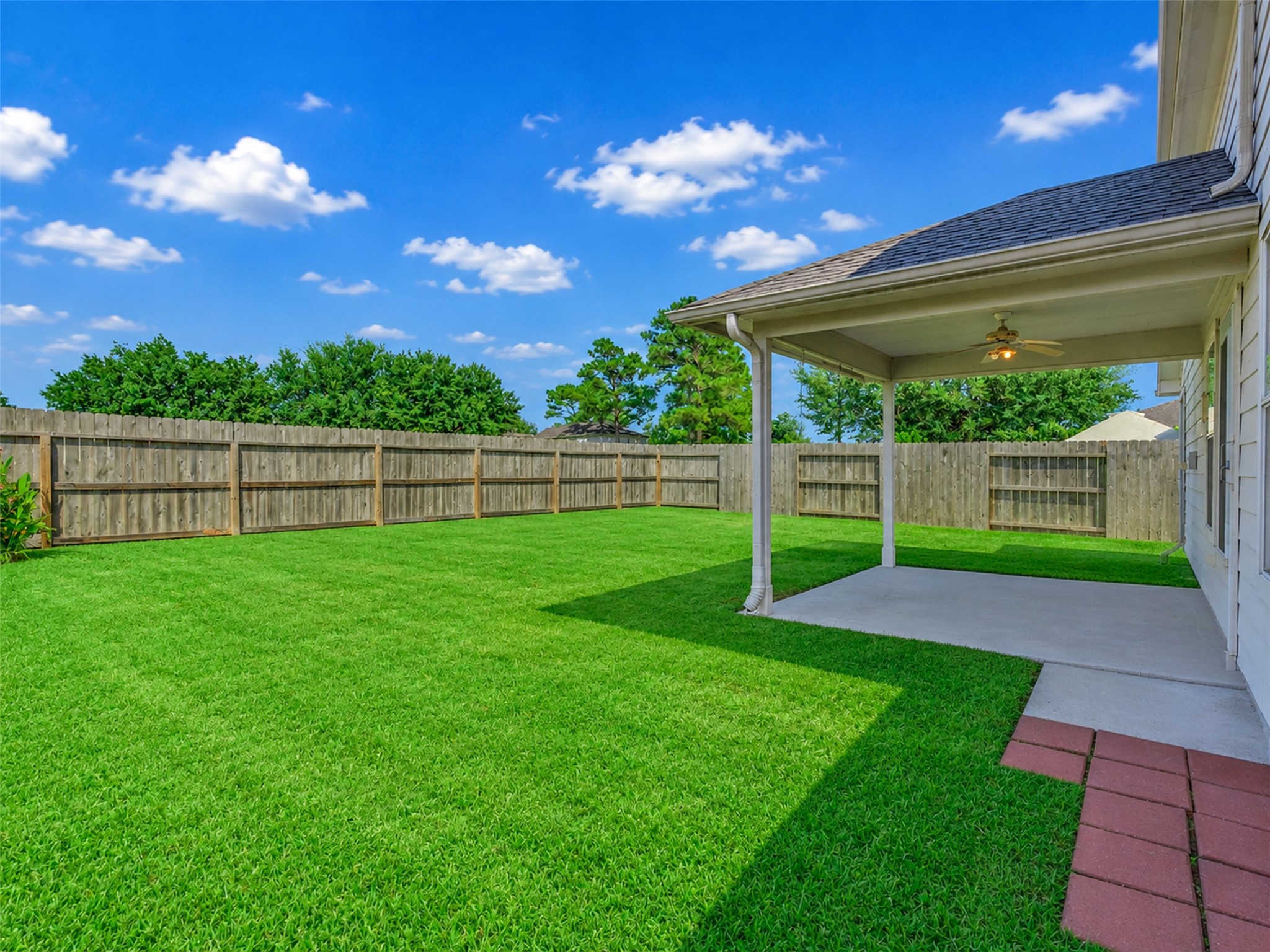 This covered patio is the perfect spot for sipping sweet tea, grilling with friends, or simply relaxing while enjoying the fresh air.