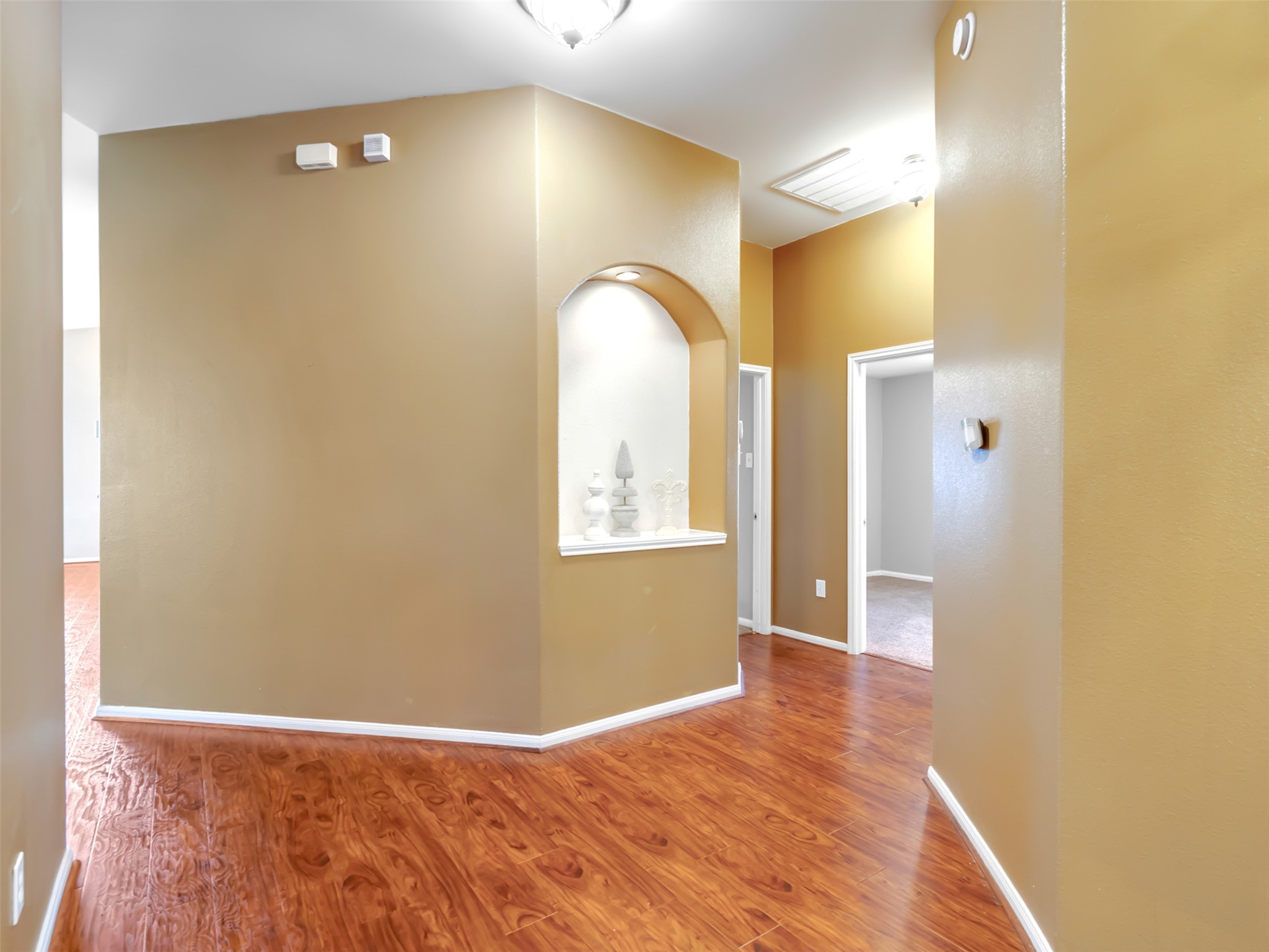 To the right you find a home office or 4th bedroom and the Primary bedroom. To the right you find a home office or 4th bedroom and the Primary bedroom.