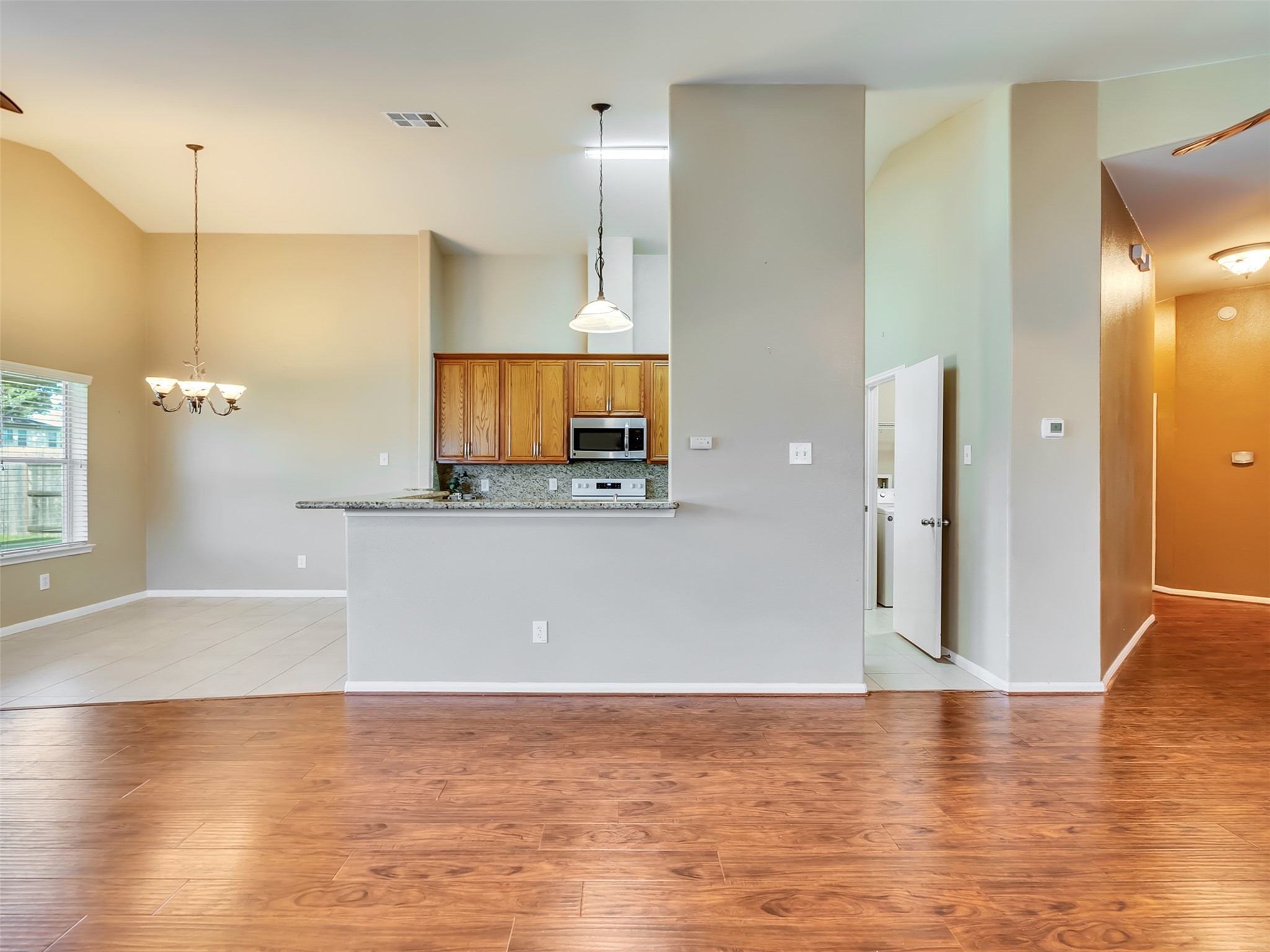 Designed with both style and functionality in mind, this spacious kitchen features a convenient breakfast bar that's perfect for casual meals, morning coffee, or chatting with family and friends while preparing your favorite recipes
