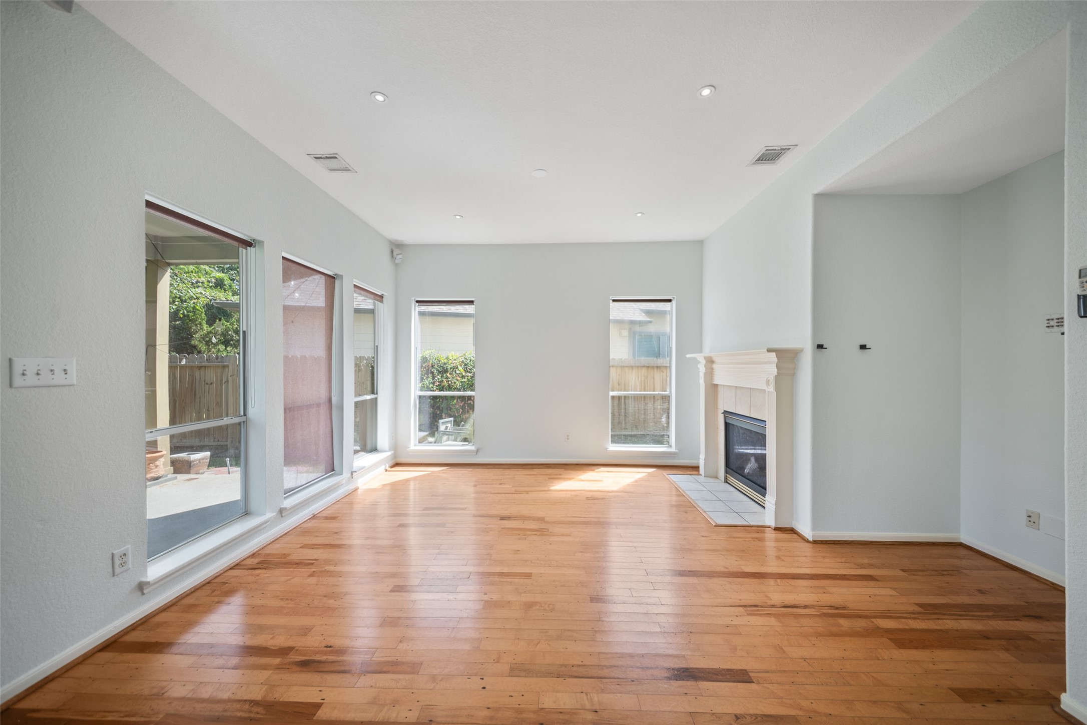 main living area equipped with high ceilings and fireplace