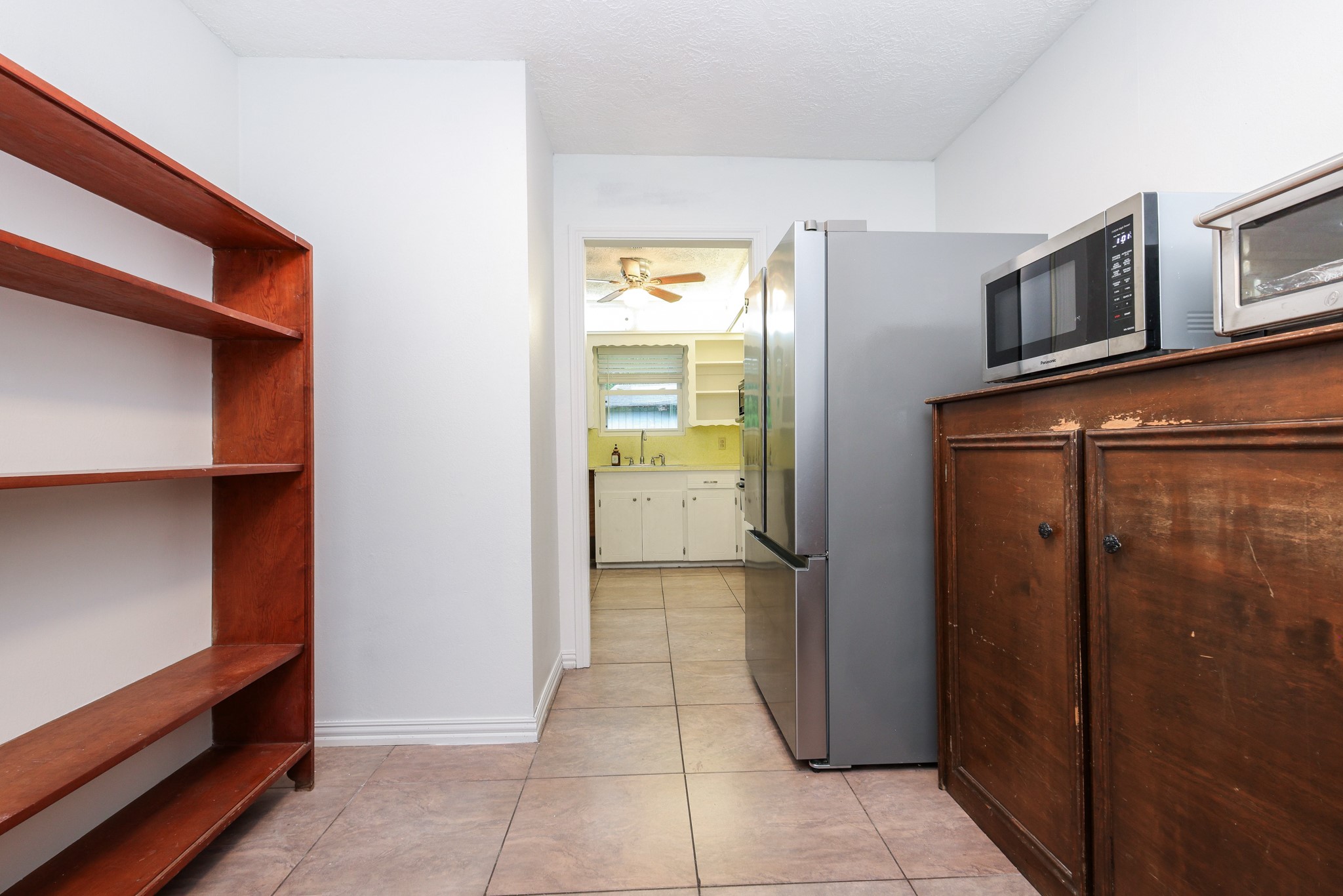 Utility Room with shelving and built-in cabinetry