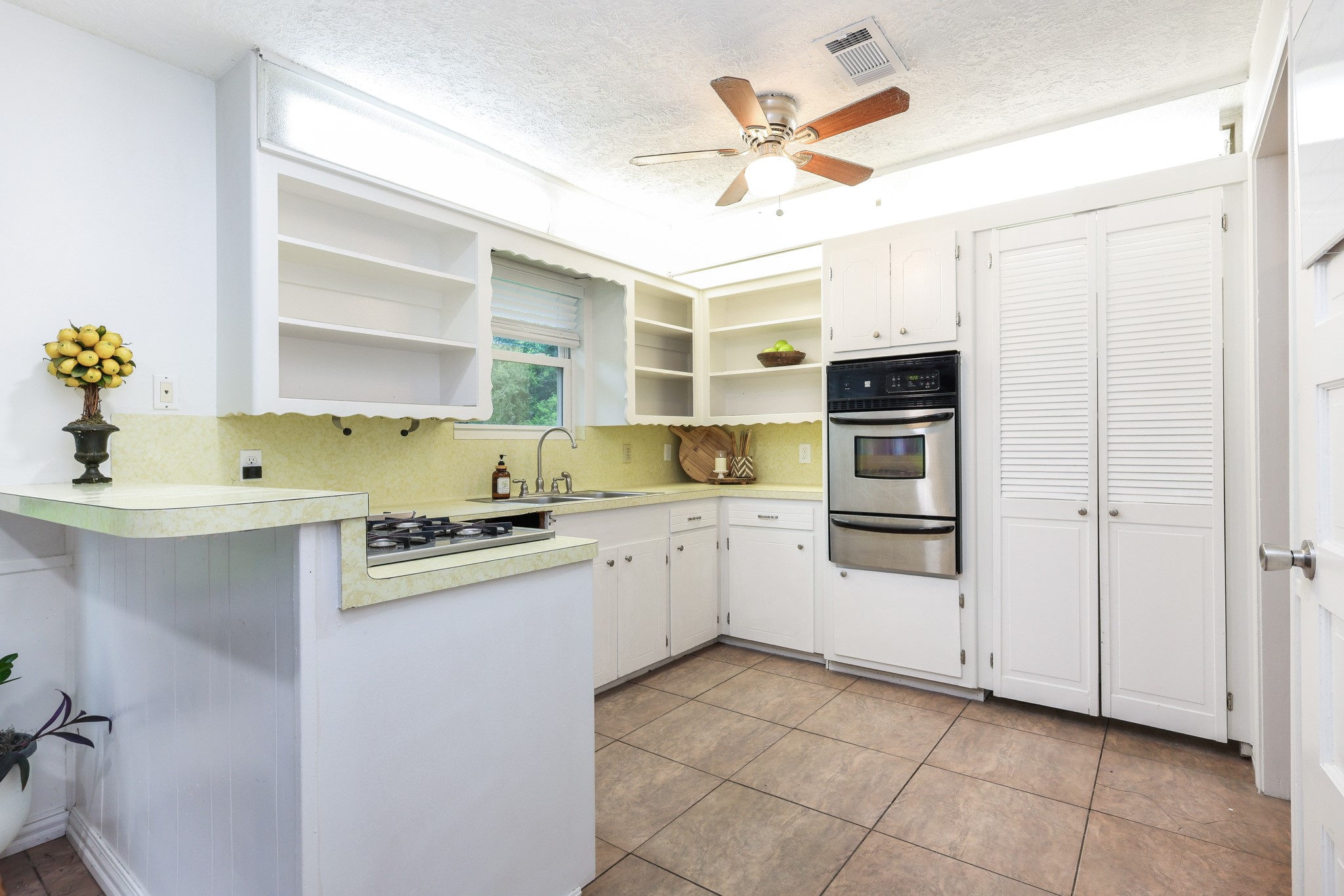 Bright Cozy Kitchen with high bar, open shelving and 2 separate pantries