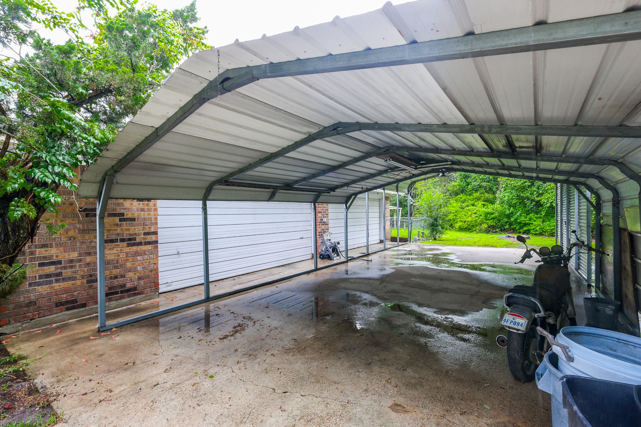 Driveway to garage with covered carports