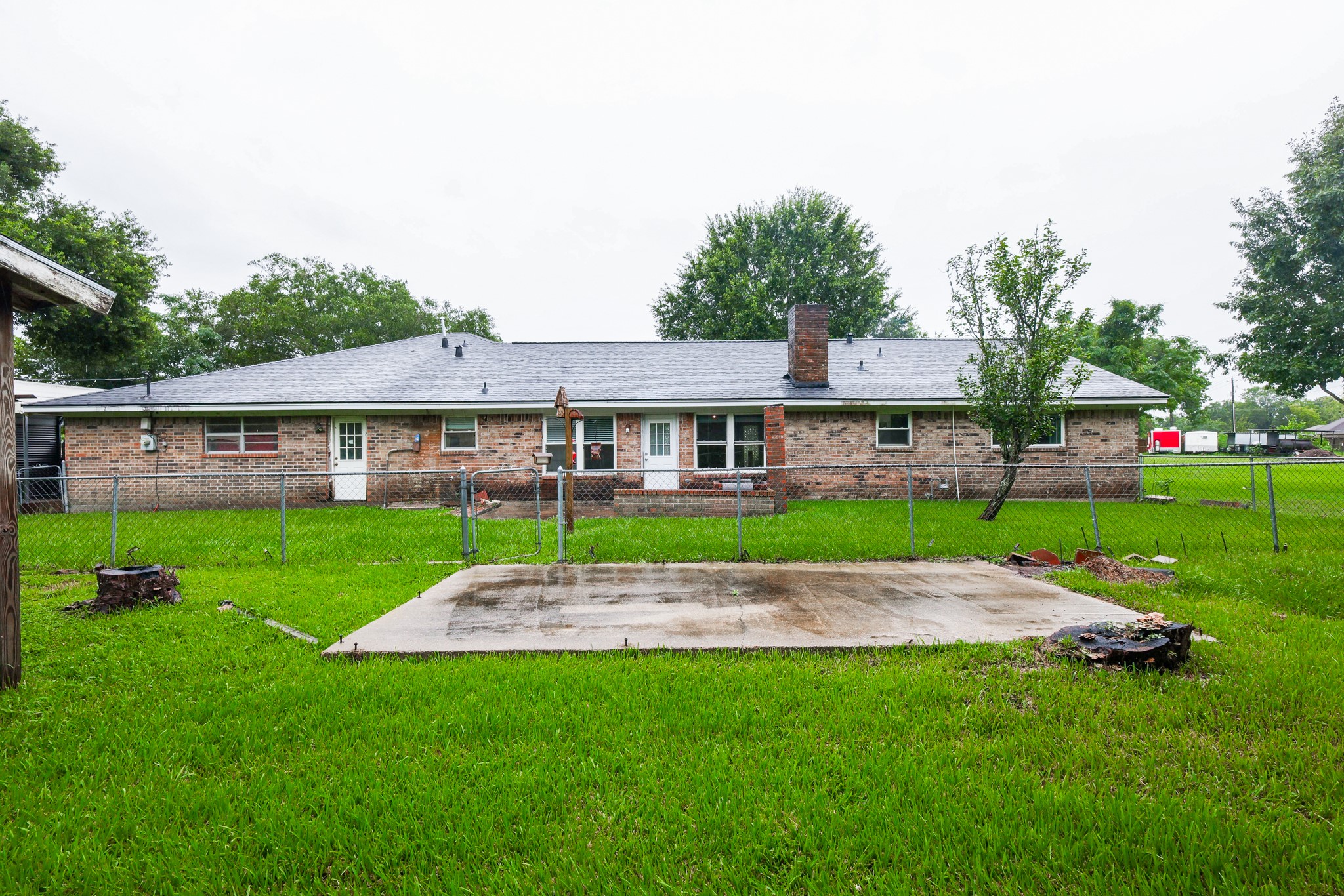 Large Backyard with a fully fenced section right off the back patio door