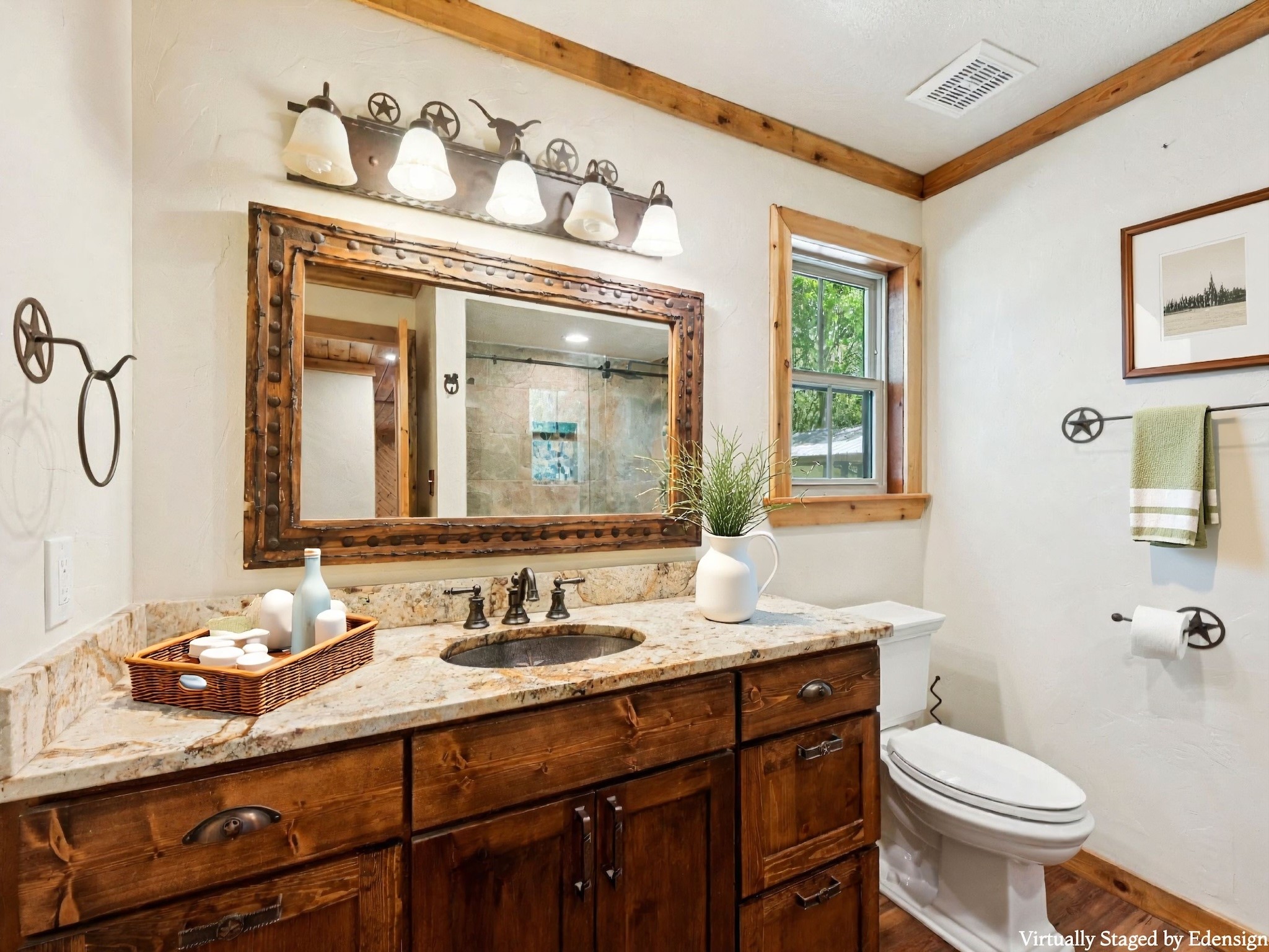 The adjacent Bathroom has a terrific framed mirror, raised vanity, and a wonderful shower.