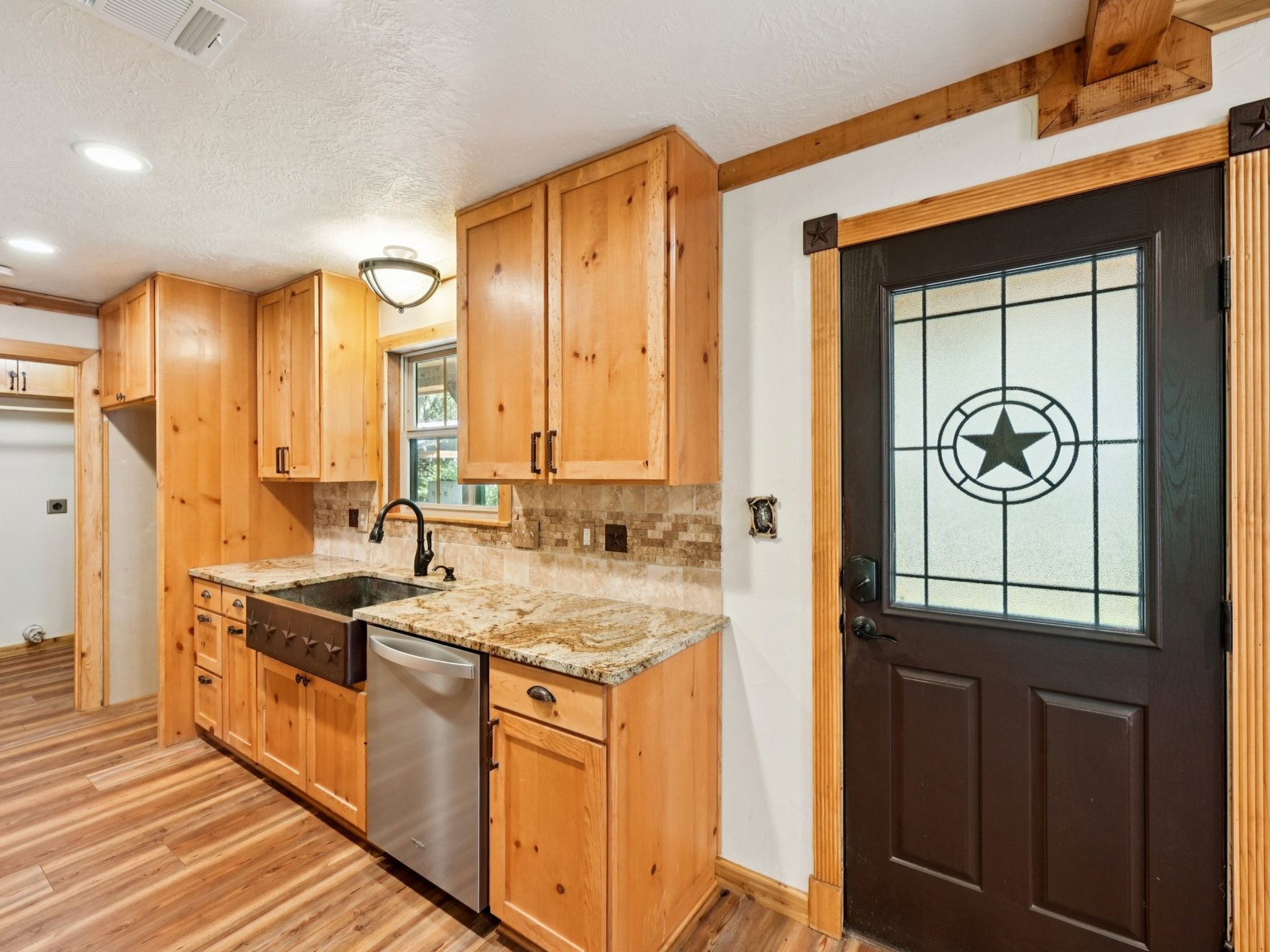 The door leading out to the covered porch has a fantastic star on it.
