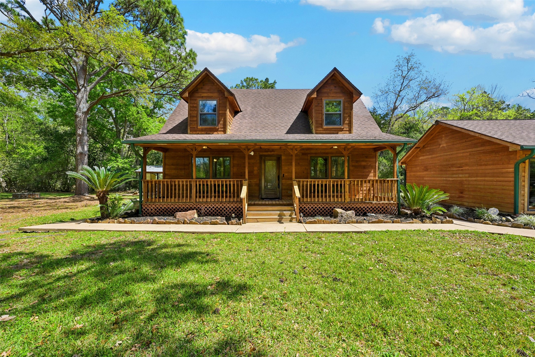 This gorgeous farmhouse home is situated on a dreamy 2.63 acre lot with mature trees and a ravine.