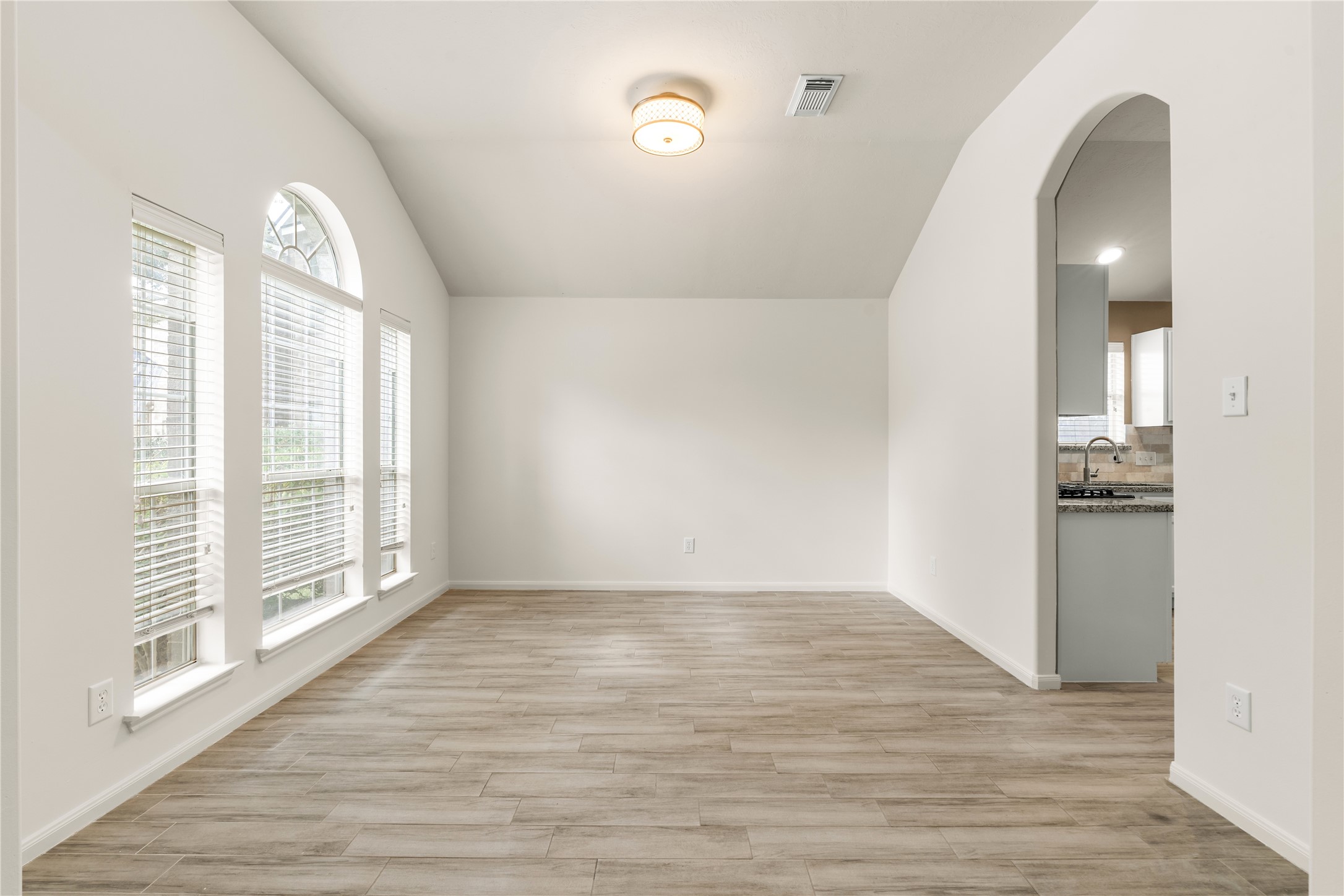 Formal dining room located between the foyer and kitchen, ideal for family dinners and entertaining.