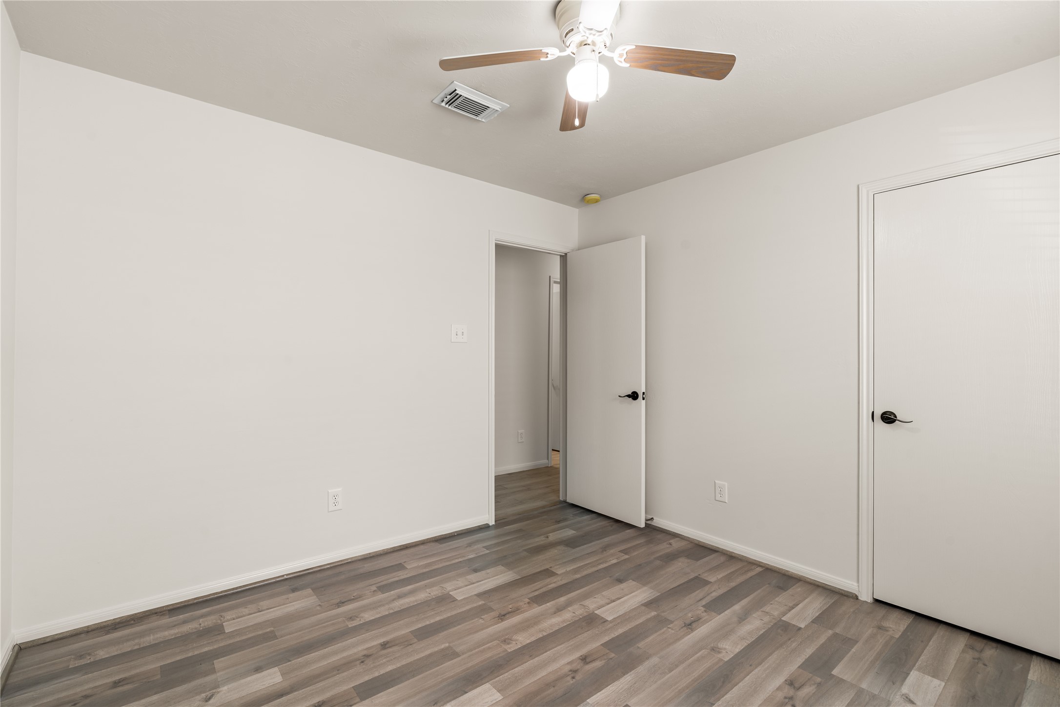 Comfortable bedroom offering privacy and functionality for family members or guests.