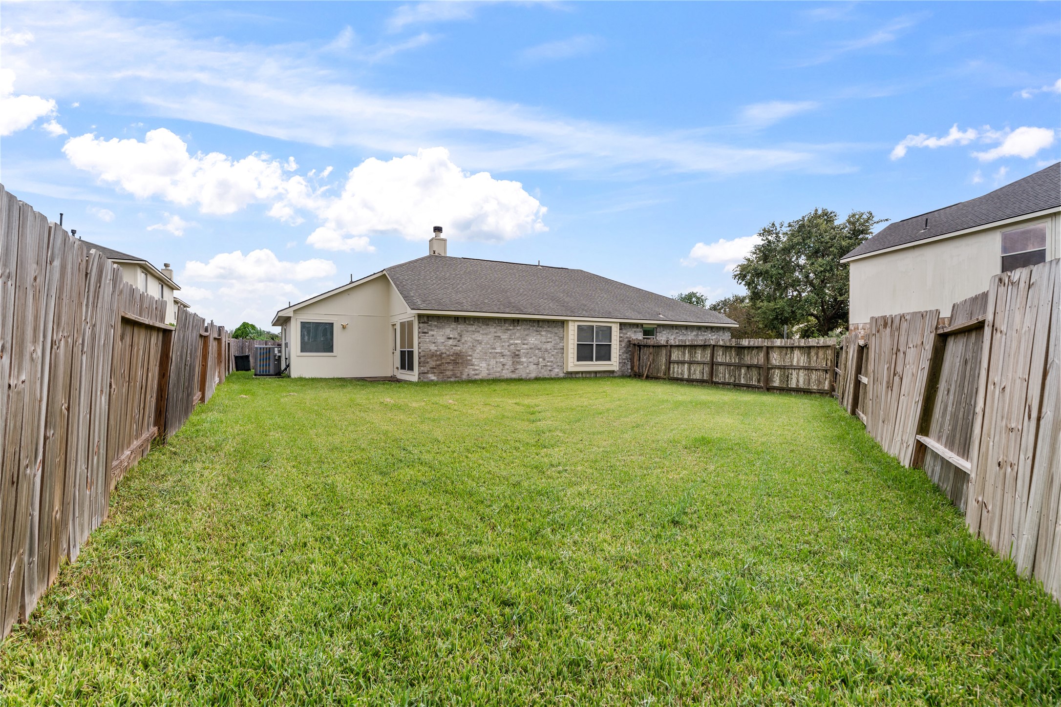 Fully fenced backyard with plenty of space for outdoor entertaining, pets, gardening, or play.