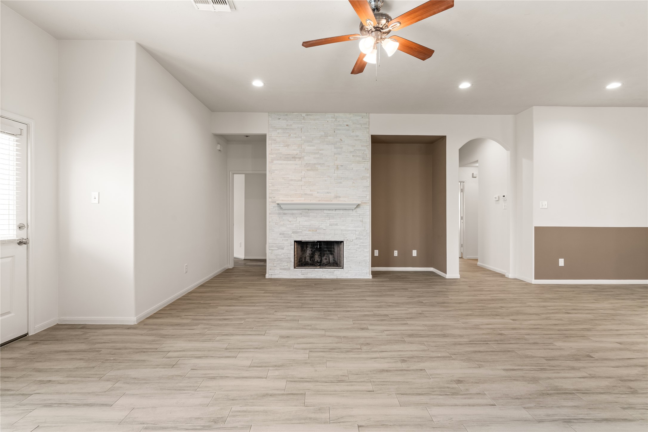 The centrally located fireplace serves as a warm focal point for the main living space.
