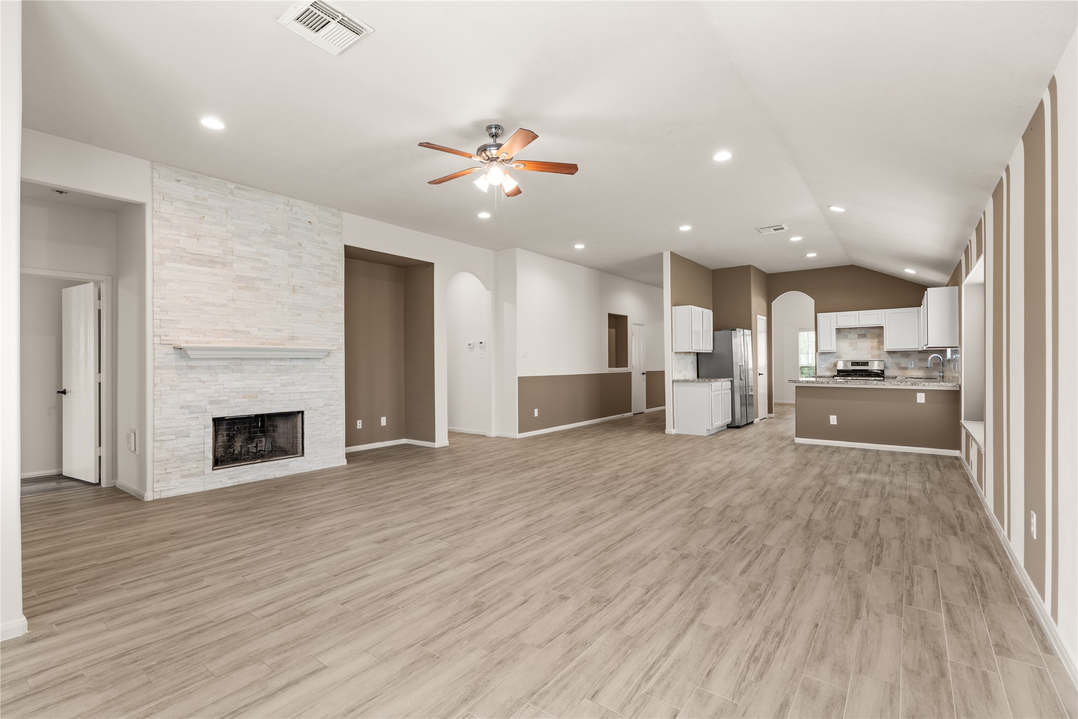Bright and airy family room seamlessly flows into the kitchen and breakfast area.