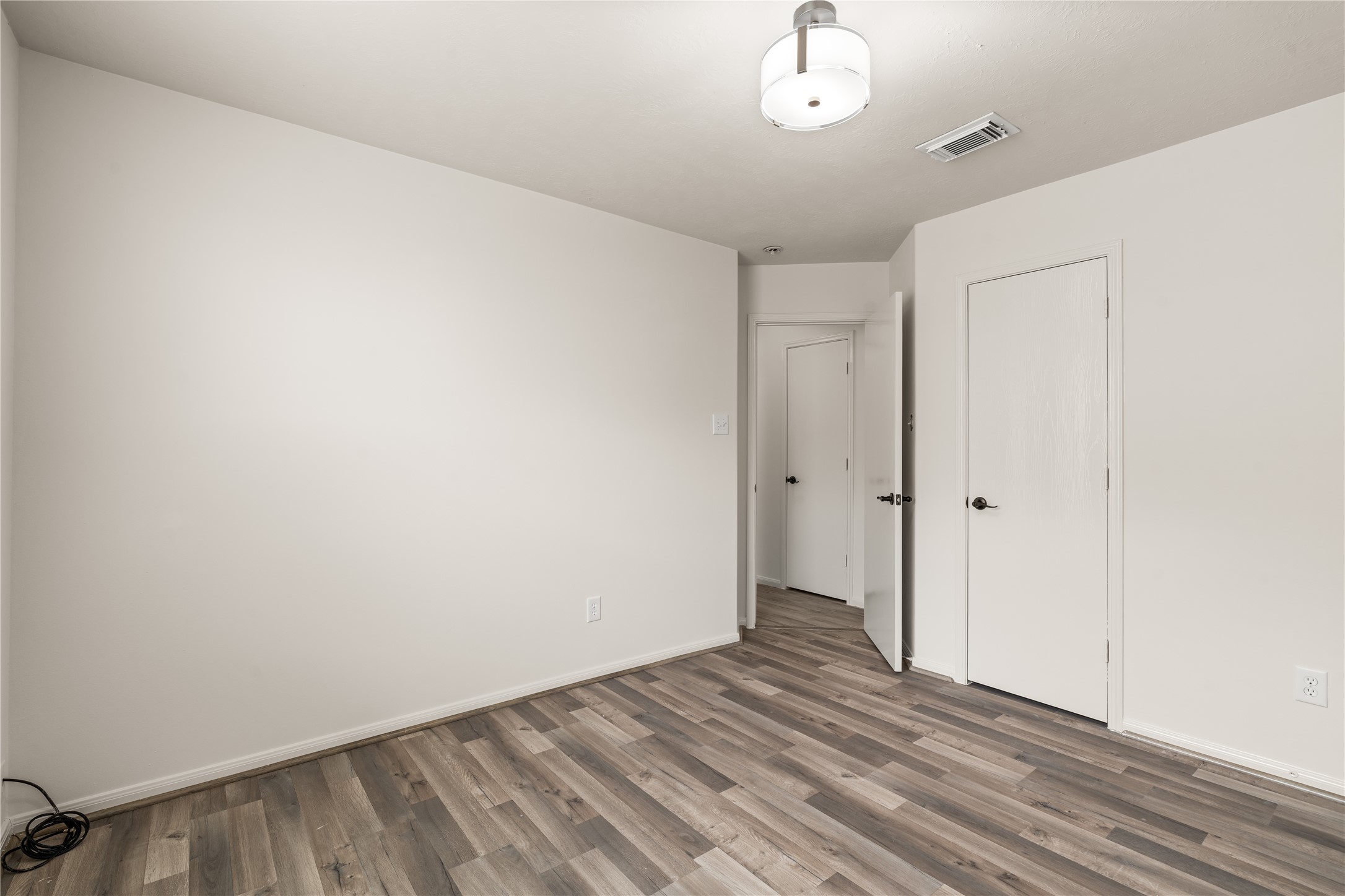 Comfortable secondary bedroom featuring a neutral color palette that's ready for your personal touch.