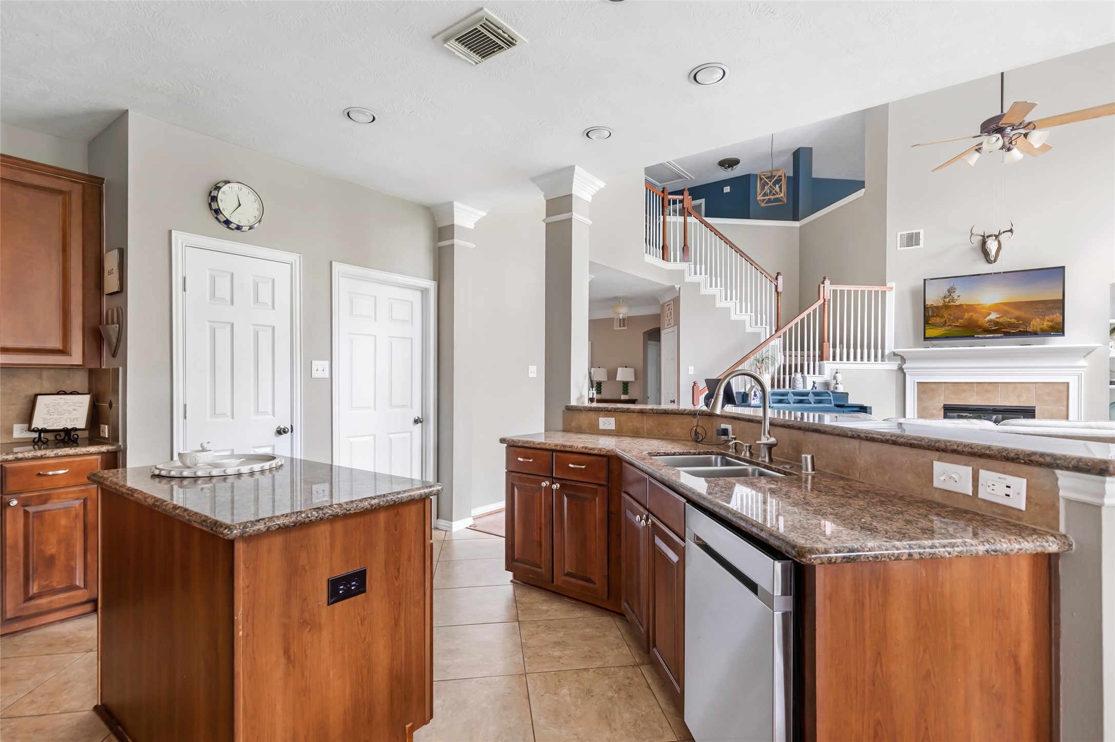 Kitchen island and breakfast bar provide additional prep space and casual seating