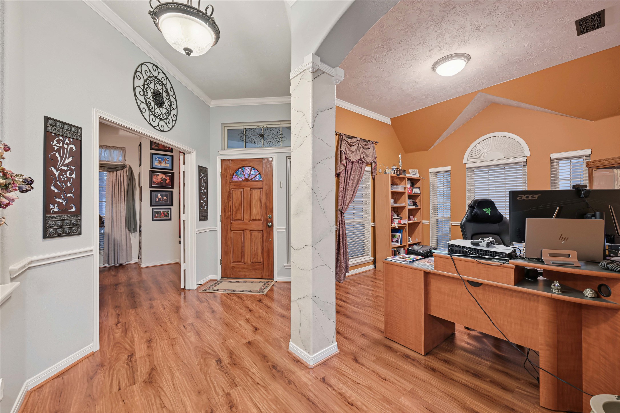 Space on the right is formal dining room, which is now being used as an office area